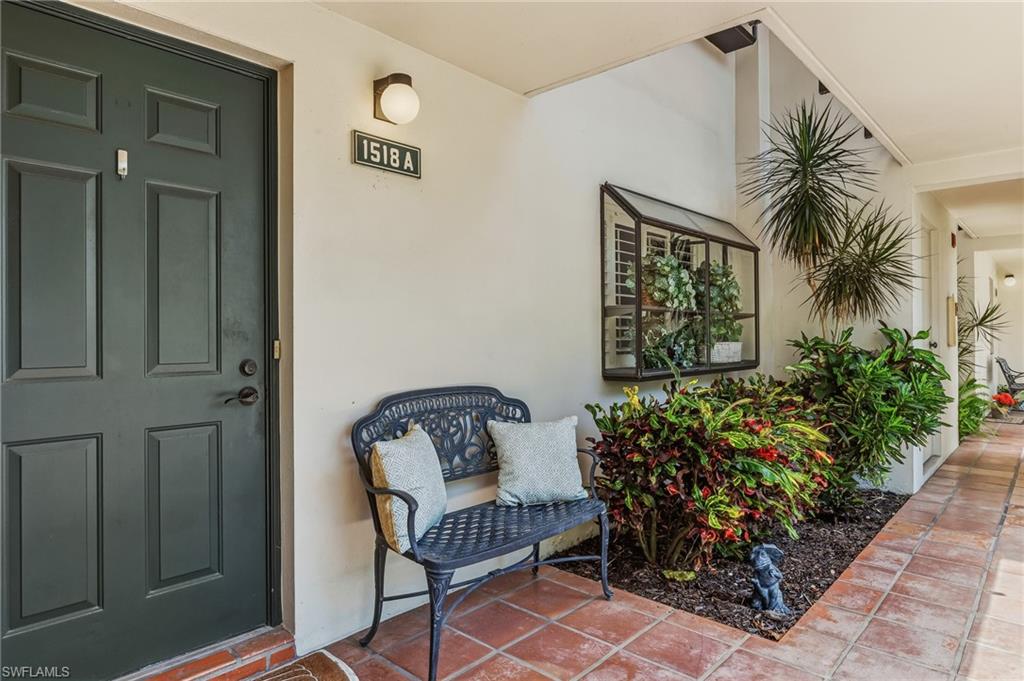 Nestled in the gated community of Naples Bath & Tennis, this conveniently located 1st floor, end-unit condo has of feeling of privacy as it is surrounded by lush landscaping. Filled with natural light, the home welcomes you with tile flooring and an open-concept design. The upgraded kitchen serves as the heart of the home, featuring light colored wood cabinetry, sleek quartz countertops, and a breakfast bar for versatile seating—perfect for cooking, entertaining, or simply gathering with friends and family. The split-bedroom layout ensures privacy, with both bedrooms offering en-suite baths appointed with The primary suite easily accommodates a king-size bed and includes a spacious walk-in closet. The Florida Room, oriented toward the east, invites you to enjoy tranquil sunrises and views of the pond, fountain, and lush greenscape. With sliding glass doors that allow the outdoors in, this space is ideal for casual dining, relaxing, or creating a bright and inspiring home office or Florida room. Additional features include an enclosed bay window in the kitchen, and a large dedicated storage closet steps from the front door. and partially furnished. Residents of Naples Bath & Tennis enjoy a heated pool, spa, and library—all within 4 miles of Naples’ world-renowned beaches and minutes from premier shopping and dining. A stylish, move-in-ready retreat in one of Naples’ most central and charming communities. Pet friendly and ready to impress.