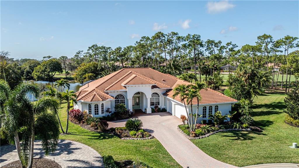 If you desire spectacular lake, golf & preserve views from your picture window style screened lanai at the end of a private  cul-de-sac in a prime golf community with southern exposure-this is it!  This quality custom home is larger than many in Wildcat Run, with 3650 sq. Ft. under air,  4 BR + den & 4 1/2 baths. The easily flowing floor plan has so many features you will love!  Set on almost a half acre, it has a 3 car garage, electric & solar pool w/spa, long lanai w/Weber grill + a built-in hood & exhaust, perfect for entertaining, an open kitchen w/soft granite countertops, S.S. appliances & light cabinetry with a wine cooler in a nearby hall, home generator + impact glass & electric storm shutters, tray ceilings, crown molding, inside & out speakers, large miter glass window to embrace the scenic views, an attractive stone on the family room wall w/electric fireplace & TV, den/study w/built-in cabinetry,  custom walk-in closets in Main BR, work bench + cabinets & an air conditioned storage room in the garage + a 2nd refrigerator. The outside of the home has been repainted, the drapery is warm & the location is quiet yet not too far from Wildcat Run’s beautifully updated clubhouse + 2nd “grill room” style building. All in an Arnold Palmer designed signature golf course community, one of the best in SW Florida, with a great location near Miromar Outlets  shopping centers , FGCU, the airport, Hertz Arena, hotels, restaurants & much more!