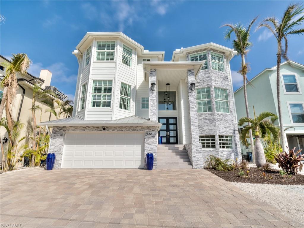 Beautiful bay front, gulf access home. This gorgeous 5 bedroom, 6 bath home offers stunning views. Open floor plan with large great room, gourmet kitchen, 5 bedrooms with on suite baths, private elevator, 6 car garage with storage room, 2 jet ski lifts and large lanai around heated pool. Home sits on beach access street, so grab your beach chair and you are steps away from the sand. Minor hurricane damage to garage level. No structural damage per report. Come see this amazing home!