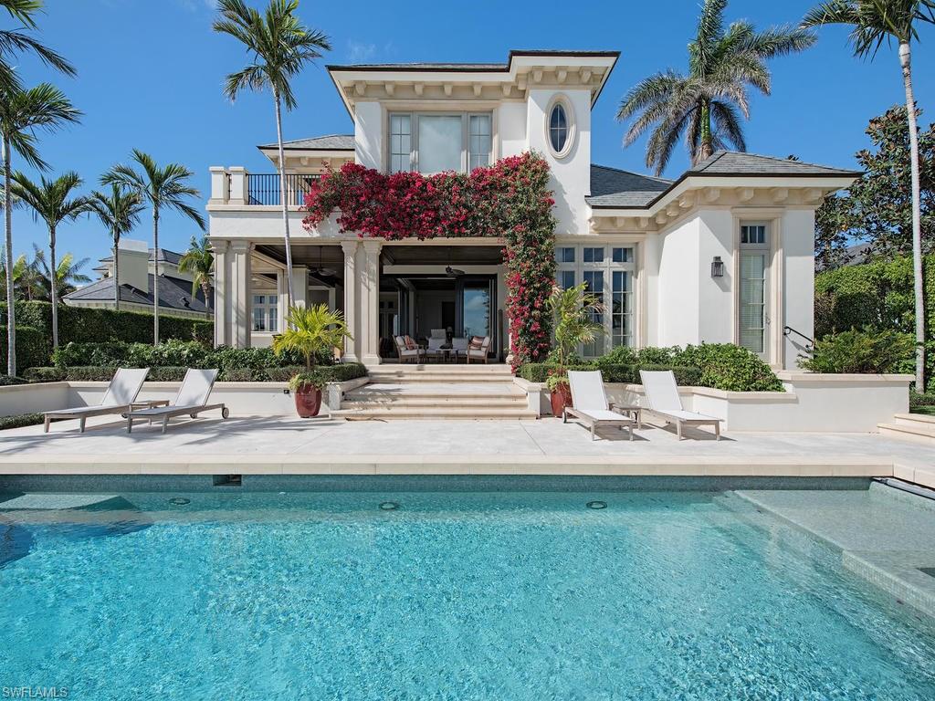 Welcome to your private escape in Port Royal! Situated with 127’ on wide water views of Man of War Cove and over 7055 square feet of air-conditioned living space, this is truly paradise inside and out. Thoughtful design and sophistication through out the home help create classic and timeless beauty. This combined with all the modern features and finishes, to create a spectacular home.  Incredible millwork and finishes compliment the grand foyer, leading into the main living areas of this home. Spectacular entertaining space, with formal dining, living rooms and great rooms overlook the water views and pool area. Disappearing doors create seamless indoors – outdoor living at it’s finest!  The outside living space is covered and provides outdoor kitchen and dining overlooking the pool area and exceptional water views. In addition to a one bedroom and bath guest home, other features include reclaimed red brick driveway from Chicago, generator, floating concrete dock and boatlift and complete home automation. This home is a must see!