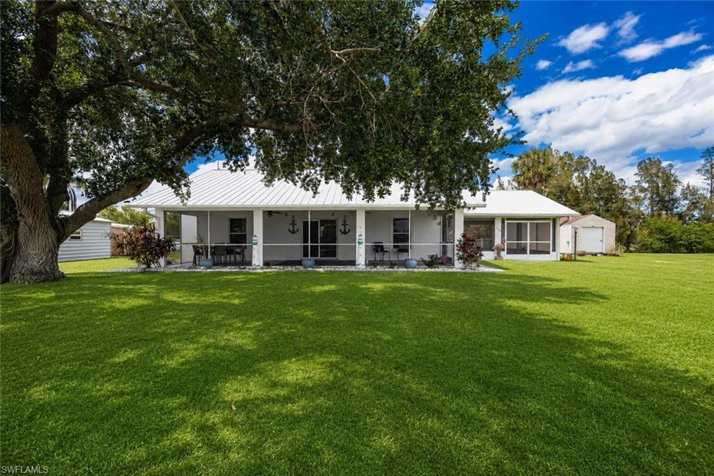 RIVERFRONT LIVING WITH ROOM TO RELAX, PLAY & EXPLORE!

Welcome to your peaceful retreat along the Caloosahatchee River in scenic Glades County, where everyday life feels like a getaway. Perfectly positioned along the Intracoastal Waterway connecting the Gulf of Mexico to the Atlantic Ocean, this beautifully updated property offers panoramic water views, incredible boating activity, and the kind of tranquility that’s becoming harder to find.

Located just down the road from the Ortona Locks and Ortona Lock Campground, this property offers a front-row seat to one of Southwest Florida’s most unique waterfront settings. Enjoy watching boats of all sizes navigate the locks from your spacious screened lanai while taking in the peaceful riverfront atmosphere. One of the standout features of this location is the convenience of having the Ortona Locks public boat ramp at the end of the road, making it incredibly easy to launch your boat and spend the day fishing, cruising, or exploring the waterways. Be sure to review the aerial photos for a closer look at the nearby locks, campground, boat ramp, and surrounding natural beauty.

The home itself has been thoughtfully renovated and features durable concrete block construction, a galvalume metal roof, and large sliding glass doors that seamlessly connect indoor and outdoor living spaces. Inside, you’ll find over 1,200 square feet with a bright open-concept layout, split-bedroom floorplan, updated kitchen with stainless steel appliances, solid surface countertops, and a comfortable great room perfect for entertaining or everyday living.

Outside, the .67-acre property offers exceptional versatility with a fenced backyard, multiple detached outbuildings, two covered parking areas, RV hookup, and plenty of room for boats, trailers, hobbies, storage, or future projects. The side covered porch area provides additional space for entertaining, relaxing, or workshop use.

Most furnishings are negotiable, offering the potential for a convenient turn-key opportunity for buyers looking for an easy move-in-ready river retreat, seasonal getaway, or furnished investment property.

Whether you’re searching for a full-time residence, winter escape, fishing retreat, or peaceful riverfront lifestyle, this property offers a rare combination of affordability, privacy, and recreation. Review the photos carefully to fully appreciate everything this unique property and location have to offer.