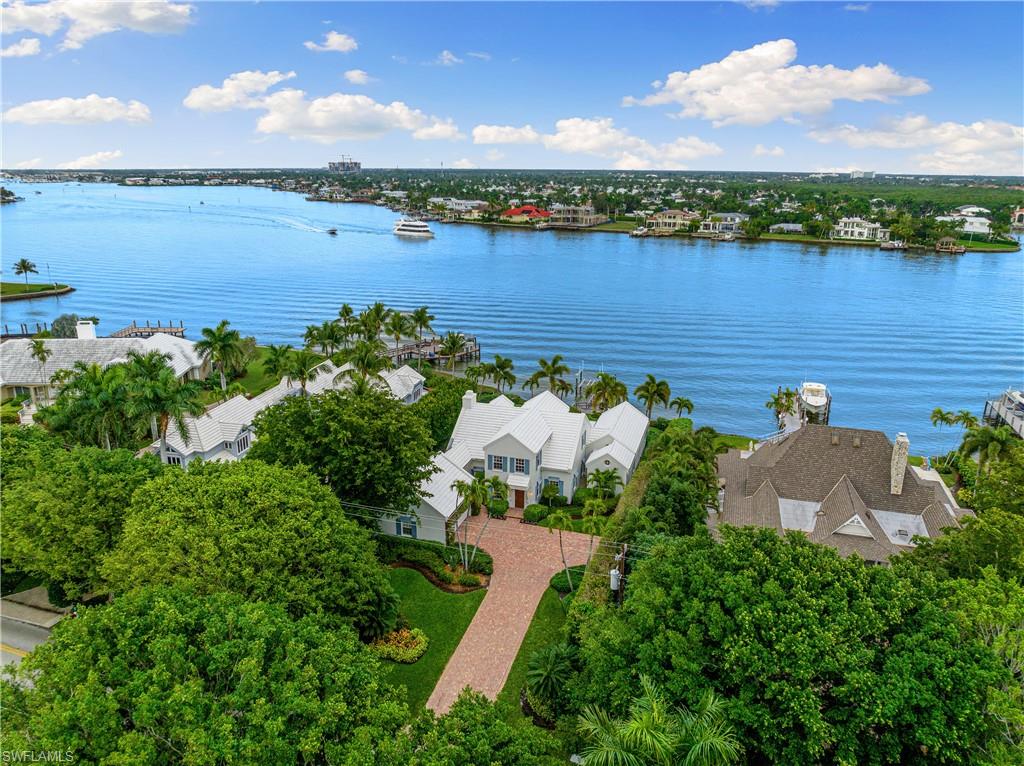 Forever views in Port Royal. Currently the only home for sale at the northern end of Galleon Dr. with breathtaking Naples Bay views. Featuring 4 bedrooms, 3 1/2 bathrooms, and a dedicated office, this home invites you to embrace its endearing character or embark on a transformation to fulfill your vision. Meticulously maintained  with thoughtful updates, this home exudes a perfect blend of classic charm and modern convenience. Recent updates have elevated the property with features such as hurricane impact windows and doors, a full house generator, and two new tankless water heaters, ensuring both comfort and peace of mind. Immerse yourself in the picturesque water views with direct Gulf of Mexico access,  where the beauty of Naples Bay and the surrounding mangroves create a captivating backdrop.  Don't miss the chance to make this timeless gem your own. Port Royal Club Membership available.