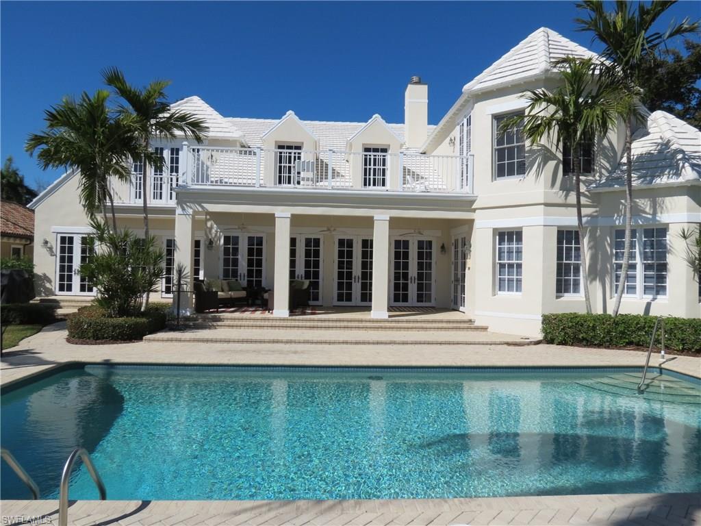 WIDE WATER VIEWS OF SMUGGLERS BAY, from nearly every room in the House. Gracious Living describes the feeling of this home. The Grand Living Room and Dining Room flow to the Veranda with a Southeastern View across the Pool and Bay. Spacious Master Suite is a Retreat filled with Natural Light. A Secondary Guest Suite / Study with en suite Bath is also on Ground Floor. The large open Kitchen overlooks a casual Gathering and Breakfast room, The kitchen is equipped with a 48" Thermadore Professional Gas Range and Sub Zero Fridge and Freezer. Four Guest Rooms with en suite Baths & Balconies upstairs along with Media room, make for a private living area for family and guests. The all Recently Updated Dock can accommodate several vessels with 16,000 pound lift for appx. 40 foot boat, double Jet Ski Lift, plus 55 feet of Dock to accommodate large in-water Yacht. The dock features appx 1000 square feet of deck space with low maintenance IPE wood and 50 amp shore power and low voltage courtesy lighting. The fireplace, pool heater and direct plumbed grill are all powered by gas. This home is conveniently located close to the Port Royal Club and Beach and is eligible for Immediate Membership.