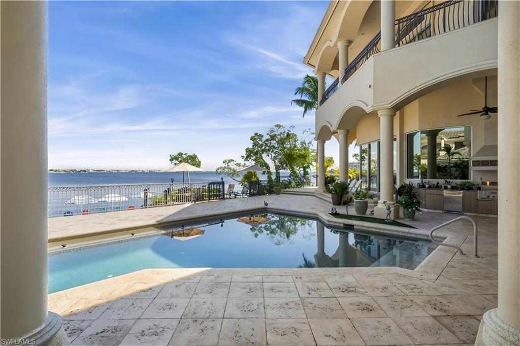 NOW IS THE TIME TO REALIZE YOUR DREAM!ONE OF A KIND estate home offers PRIVATE BEACH! NEW ROOF 2023! WHOLE HOUSE GENERATOR! Set on an oversized 1/2 acre lot offering 4 B/R + den, a theater room with a full bath and kitchenette.  This could be transformed into a 5th bedroom. 6.5 baths and almost 8000 sq. ft. UNOBSTRUCTED views of the river! Covered & open outdoor spaces, pool/spa, rock waterfall, outdoor kitchen, seating with fireplace, pool bath with STEAM ROOM, relaxing lounging deck. Entry w/28ft ceiling leads to formal dining area that flows into a MAGNIFICENT GOURMET CHEF'S KITCHEN with 16ft tray ceiling, 6 burner gas stove & wood cabinetry. Formal & informal spaces. 1st level exquisite primary suite with zero corner sliders, walk-thru shower, soaking tub.2 private water closets with bidet. Stunning well appt. office.1st & 2nd floor laundry rooms. Sound system. PRIVATE ELEVATOR. 4 car garage with A/C. 3 second level ensuite bedrooms. ENJOY an 18 HOLE PRIVATE CHAMPIONSHIP GOLF COURSE,8 Hydro-Grid (clay)LIGHTED TENNIS COURTS, a private island! Gulf Harbour’s state-of-the-art HarbourView Center for Sports & Wellness was designed for Members to get healthy and stay healthy. It’s a 24,000 square foot facility that houses TechnoGym equipment ,fitness studios including Pilates, TrackMan indoor golf, spa, infrared saunas, steam, weekly fitness classes, TRX, Yoga, Barre, Group Cycle .Top notch fitness staff consisting of personal trainers & nutrition experts will provide our Members with the best wellness programs. Marina boasts 186 wet slips ranging in sizes. Only 4.5 nautical miles with direct access to the Gulf. PRIVATE MEMBERSHIPS ARE AVAILABLE IMMEDIATELY FOR A SEPARATE PURCHSE TO ENJOY ALL THAT GULF HARBOUR HAS TO OFFER!!!