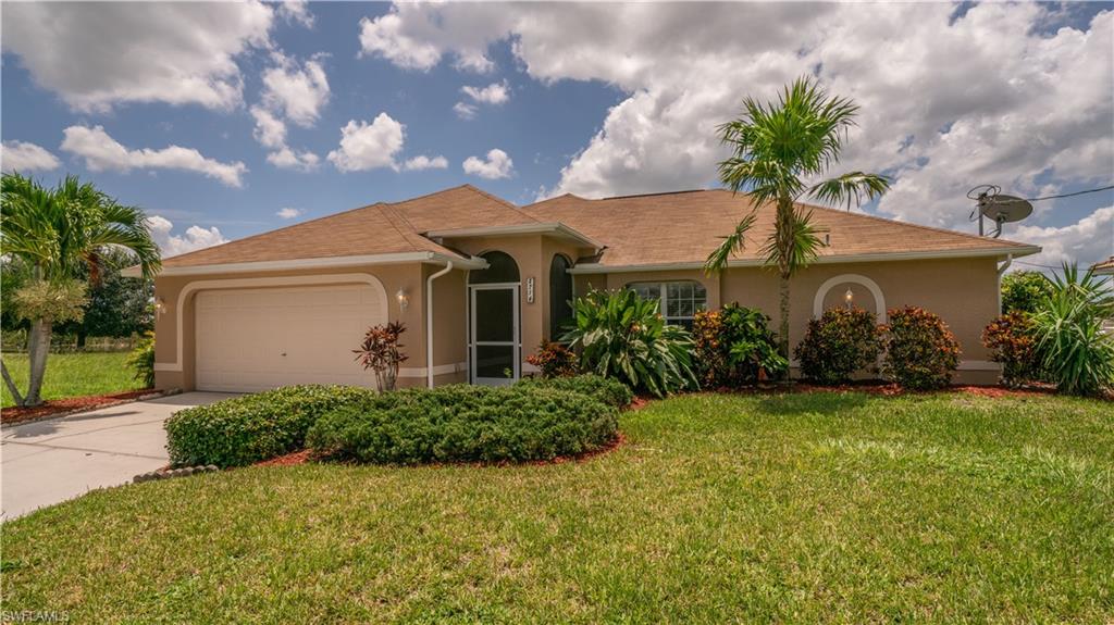 From the moment you drive up you'll notice the large Royal Palm Trees that line the street. This SOUTH facing house maximizes the Florida Sun if you want to add a pool in the future.  Outside has been freshly painted with new light fixtures.  Beautiful landscaping with a front entry porch allowing the winter breezes to flow through the home. 4 bedroom 2 bath with tile in the main area.  Enjoy entertaining with the open kitchen and breakfast bar.   This home has a Whole House Reverse Osmosis System and a newer Air Conditioner.   Nice under-truss lanai to enjoy the waterfront view.   Easy access to miles of freshwater fishing and nature.  Trex Board Dock allows you to easily access the water with your kayak.  Great neighborhood within minutes of shopping, restaurants, two golf courses and public boat ramp for gulf access waters.  Easy to show!