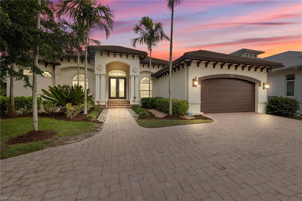 Discover the epitome of luxury living with this exquisite home that embodies the perfect harmony of elegance, comfort, and waterfront living in the coveted Royal Harbor neighborhood. Built in 2004, this residence features a spacious open floor plan that seamlessly blends for the ultimate indoor/outdoor living. With three sizable en suite bedrooms plus a den that easily doubles into a 4th bedroom, a powder bath, this home effortlessly marries comfort and functionality, ensuring that every aspect of your waterfront living experience is both elegant and practical. The exterior of this remarkable property extends an invitation to outdoor living at its finest, boasting a generously sized pool, a soothing spa, and an enchanting overflowing fountain, creating a picturesque oasis that is perfect for relaxation and entertaining and all overlooking the intersecting canal with your own private boat dock and lift, inviting endless days of boating adventures on Naples' picturesque waterways with direct gulf access.