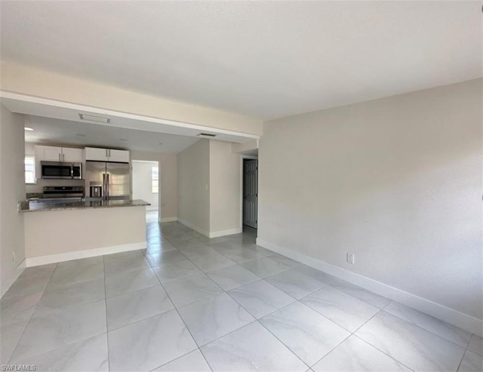 Welcome to this super cute and newly remodeled 3 bedroom, 2 bath home with an attached efficiency with its own private entrance. This property features an open floor plan with lots of beautiful sunlight. Don't miss out! This home is ready to be enjoyed by a new family or could be a wonderful investment, or income producing property. Don't even get me started on the location, just minutes away from the stunning Naples' beaches, 5th Ave, Tin City, Celebration Park & the Naples Botanical Garden!