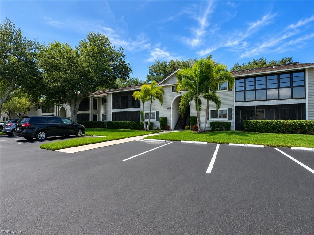 One or more photo(s) has been virtually staged, AI generated or rendered.  Ideally located within the gated community of Summerlin Woods, this beautifully maintained residence offers the perfect blend of comfort, convenience, and Southwest Florida living just minutes from Fort Myers Beach, the Sanibel Causeway, HealthPark Medical Center, Lakes Park, restaurants, shopping, and two Publix grocery stores. Filled with natural light, the thoughtfully designed floor plan features soaring vaulted ceilings, an inviting living area, breakfast bar, and an air-conditioned Florida room overlooking lush tropical landscaping, creating additional year-round living space. The spacious primary suite features sliding glass doors to the Florida room, a walk-in shower, and a generous walk-in closet, while the guest bedroom also offers its own walk-in closet. Recent improvements include a NEW 2025 A/C system with a transferable 10-year warranty, new microwave, new garbage disposal, and new carpet in the guest bedroom. A full-size washer and dryer and private owner's storage closet provide added convenience. The HOA includes water, cable TV, landscaping, and access to outstanding community amenities including a resort-style pool, tennis courts, grilling areas, a car wash station, and gated entry. Whether you're looking for a full-time residence, seasonal retreat, or investment opportunity, this move-in-ready home offers exceptional value in one of Fort Myers' most convenient and desirable locations.