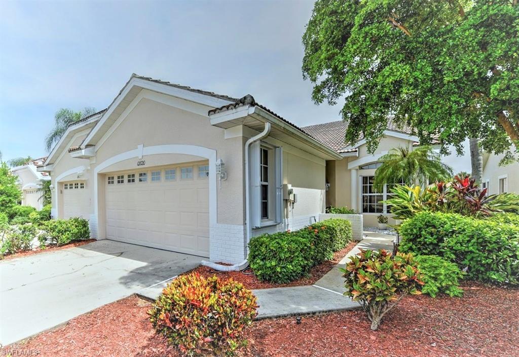 This villa has the perfect combination of features and location! The 3/2 split floor plan lends itself to both convenience and privacy while the water view can be appreciated from multiple areas including the spacious screened lanai, master bedroom or the inviting living area.  A number of recent upgrades make it feel like a model home: paint throughout, recessed lighting, new fixtures and appliances in the kitchen, new washer and dryer (in residence and not the garage), window treatments, bathroom cabinetry, light fixtures and more.  The natural light and tasteful decorating feels open and refreshing at every turn.  Hurricane shutters are attached at windows with Storm Smart roll down screens on the lanai.  Cabinets and shelves have been added to the garage for ample storage.  The front courtyard was re-landscaped for a clean and inviting appeal.  The tile roof is on the community wait list to be replaces soon.  Devonshire Lakes is a non-gated community with low HOA fees that has a community pool and cabana yet is also within the Gateway development which offers access to additional parks, jogging paths, shopping and even optional golf and social memberships.  This is a must see!