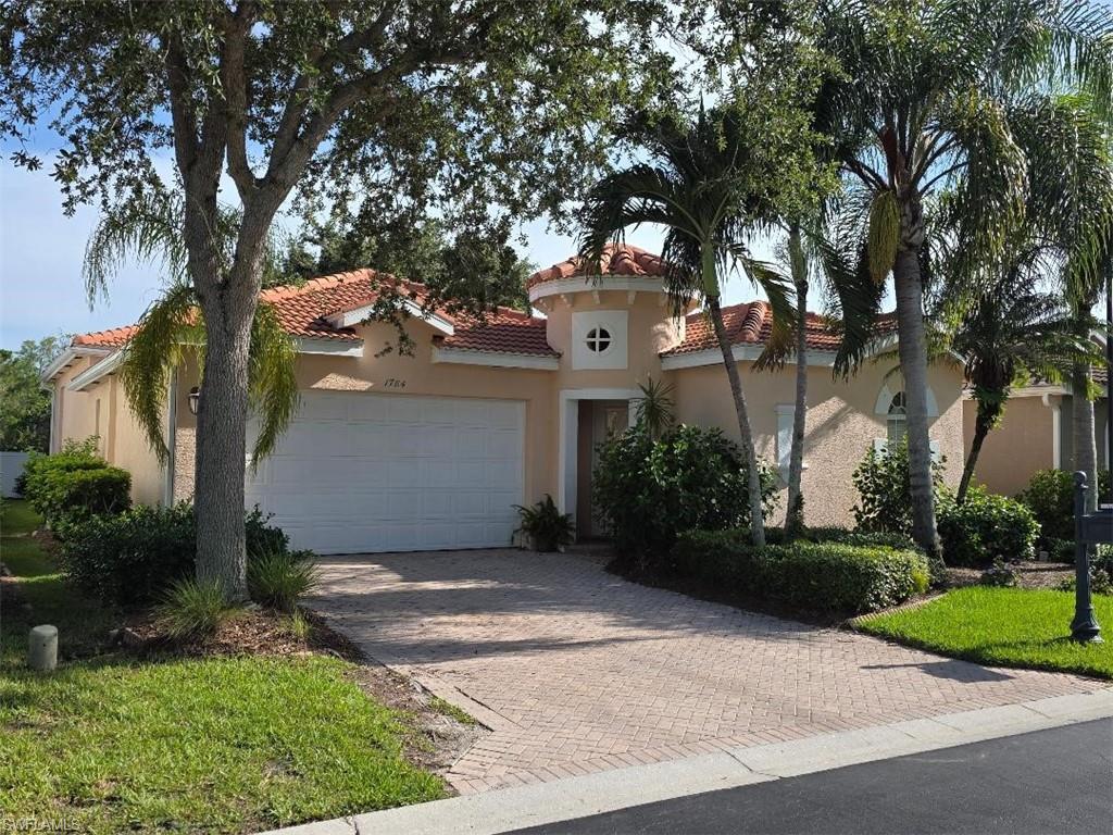 Experience refined Florida living in this beautifully updated 3-bedroom, 3-bath home featuring an in-ground pool and private screened lanai—perfect for relaxing or entertaining. Inside, soaring 12' ceilings, elegant crown molding, and an open layout create a bright, sophisticated atmosphere. The spacious master suite offers dual vanities, a generous walk-in closet, and a deep soaking tub.

Modern upgrades include stainless steel LG appliances, refaced kitchen cabinetry, a glass-accent backsplash, and luxury vinyl flooring throughout the main living areas and guest bedroom. The master suite features newly installed carpet for added comfort. Additional improvements include a newer pool pump motor, 2020 tile roof, 2021 HVAC system with parts and labor warranty, and a brand-new 2025 water heater. A wide two-car garage and paver driveway add convenience and curb appeal.

The split floor plan provides a private guest suite with its own full bath—ideal for visitors, a home office, or multigenerational living. Fresh interior paint enhances the home’s move-in-ready feel.

Situated in the highly desirable Sterling Oaks community, residents enjoy resort-style amenities including a clubhouse with dining and bar service, junior Olympic pool, fitness center, sauna, bocce, pickleball, and a children’s play area. Tennis enthusiasts can opt into an affordable membership offering access to 12 lighted Har-Tru courts and on-site professional instruction.  All just minutes from world-class beaches, dining, shopping, and the airport.