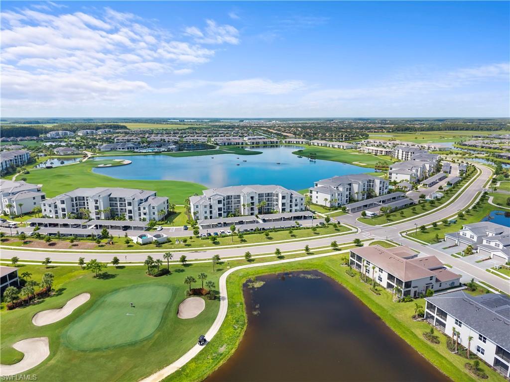 One or more photo(s) has been virtually staged, AI generated or rendered.  Step into elevated resort-style living with this top-floor, corner-unit condo in The National Golf & Country Club at Ave Maria—offering bundled golf membership included and sweeping golf course and water views.
This beautifully maintained 2-bedroom, 2-bath residence is filled with natural light thanks to its premium corner location, creating an open and airy feel throughout. Freshly painted and thoughtfully updated, the home features a modern kitchen with custom backsplash, a spacious island ideal for entertaining, and seamless flow into the main living area.
Enjoy peace of mind and convenience with covered assigned parking and a rare, oversized storage unit, perfect for golf gear, bikes, and seasonal items.
Living in The National means access to a true resort lifestyle. Residents enjoy a Gordon Lewis-designed championship golf course, a stunning resort-style pool with lap lanes and tiki bar, and a newly completed clubhouse with full-service dining, bar, and social spaces. Additional amenities include pickleball, tennis, and bocce courts, a state-of-the-art fitness center, and a full-service spa—all within a beautifully maintained, gated community.
Whether you're looking for a full-time residence, seasonal escape, or investment opportunity, this condo offers the perfect combination of luxury, convenience, and lifestyle.
One or more photo(s) has been virtually staged, AI generated or rendered.