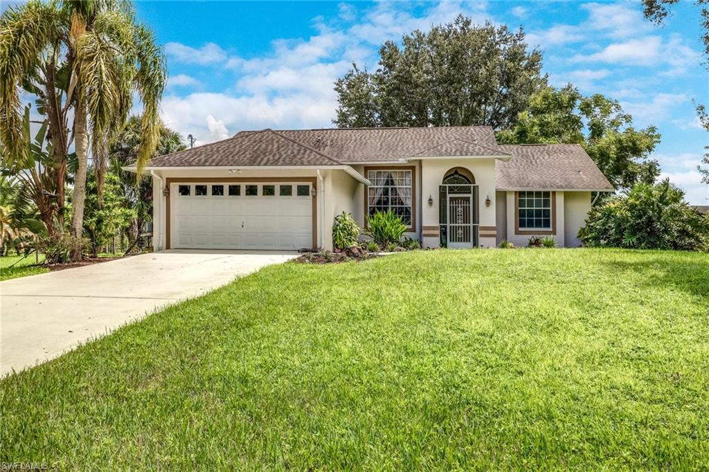Desirable Estates Home  on over 2.7 Acres!  Located east of Collier Blvd this home offers plenty of privacy and beauty with no HOA fees.  With high ceilings and an open kitchen to living room appeal there is plenty of room for entertaining. Features include an eat in kitchen, separate dining room, nice size master with walk in closet and split floor plan to divide your other two bedrooms. Enjoy the lanai overlooking the tropical oasis where there is plenty of room should you desire a pool.  The home has neutral tile and recent upgrades include granite and stainless appliances. Paved driveway with additional parking in front. This is a MUST SEE!