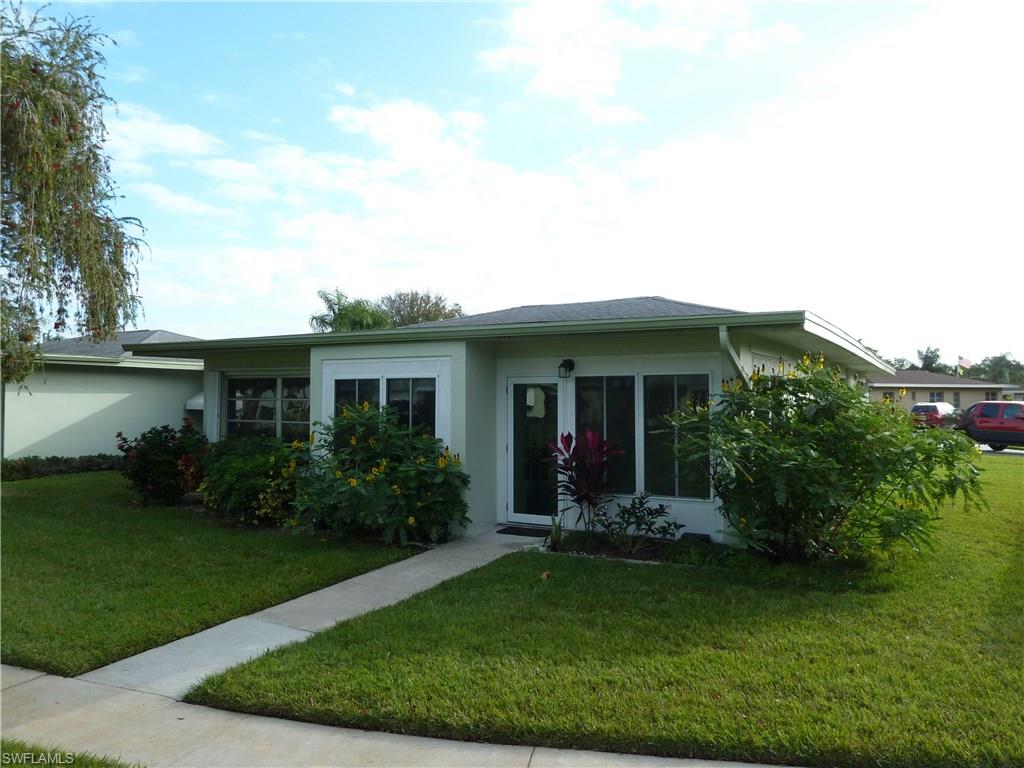 WHISKEY CREEK VILLA!  PRISTINE, YET CASUAL & COMFORTABLE.  Appreciate the welcoming feeling you get as you enter your new 2 BR / 2 BA VILLA with enclosed LANAI!  SPACIOUS, LIGHT & BRIGHT home!  Fully enclosed GARAGE with modern door.  Enjoy the BEAUTIFUL, LIGHT, HI-END WOOD LAMINATE FLOORING throughout the living areas, installed in 2015.  FORMAL DINING area for INTIMATE ENTERTAINING.  SPIC–N-SPAN KITCHEN with GLEAMING WHITE CABINETRY, PANTRY & BREAKFAST AREA!  Master bedroom has a WALK-IN CLOSET!  HOME OFFICE / DEN with built-in book case.  FRENCH DOORS open to a SUNNY, GORGEOUS, and TILED LANAI AREA.  ROOMY Guest Bedroom.  LARGE LAUNDRY ROOM with BUILT IN STORAGE CABINETS.  ACCORDIAN STORM SHUTTERS protect all windows except lanai which has panels in garage ~ FRESHLY PAINTED Kitchen, Den & Hall late in 2015 ~ NEW FRIDGE & DISHWASHER 2015 – SPOTLESS HOME!  LUSH, TROPICAL LANDSCAPING enhances the WELCOMING CURB APPEAL!  VERY CLOSE to PRESTIGEOUS WHISKEY CREEK GOLF COURSE!  Please see VIRTUAL TOUR.