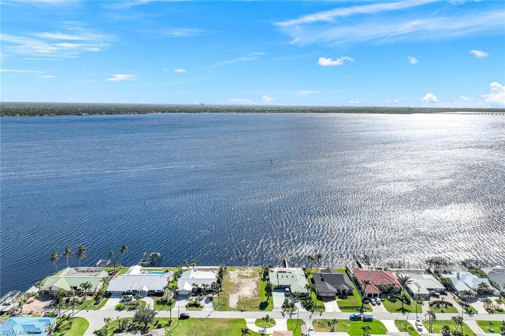 Brand new Seawall - Stunning Riverfront lot, southern exposure, prime location, rare and unobstructed million dollar view with direct Gulf access, providing space for a private dock. No bridges, calling all boaters, dolphin and manatee lovers. The lot is cleared and ready for construction, offering easy access to utilities, all assessments are paid. Secure your slice of paradise, this is the perfect Canvas to bring your vision to life and craft your very own oasis in the heart of Cape Coral. Just minutes to Horton Park, Midpoint Bridge, Downtown Cape Coral and Fort Myers, dining, shopping, entertainment, golfing, schools and medical facilities.