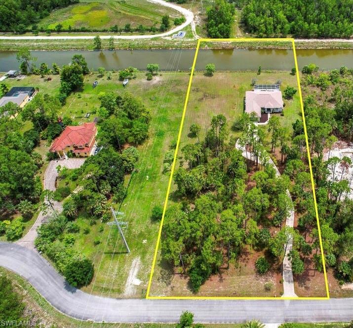Welcome to Safe Harbor, a small gated community of only 9 lots! Enjoy the privacy while still enjoying the larger estate lot size and extremely low HOA fees. This 3 bedroom 2 bathroom home sits on a 2.79 acre lot on a canal. The home has an airy open feel as you walk through the living and family room areas.  Enjoy the zero corner sliders in the family room that open completely to the large lanai overlooking the pool and spa. Newly painted interior, new carpets, AC 4 years and roof 3 years. Close in location with easy access to major stores and I75.