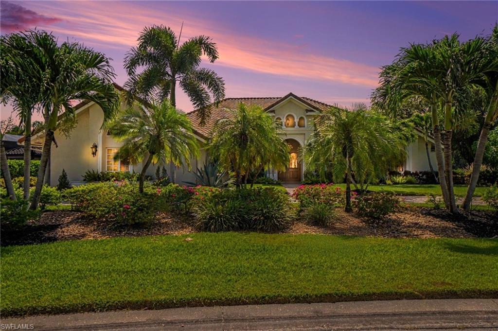 This custom-built estate sits on nearly a half-acre homesite and offers more than 3,700 square feet of luxurious living space, blending privacy, sophistication, and energy-efficient living. Designed for both everyday comfort and elegant entertaining, the open-concept floor plan is anchored by a gourmet kitchen and spacious family room that seamlessly flow to the expansive screened lanai overlooking one of Wildcat Run's most breathtaking long lake views.

The outdoor living area is truly a private retreat, featuring a custom free-form pool that has been recently resurfaced, a brand-new pool heater, and ample space to relax while enjoying spectacular sunsets across the water. Adding tremendous value and efficiency, the home is powered by a comprehensive solar energy system, significantly reducing utility costs while supporting a sustainable lifestyle.

Inside, you'll find rich Cherry wood flooring, volume ceilings, and a luxurious owner's suite complete with marble flooring and dual walk-in closets. The thoughtful layout provides generous living spaces and abundant natural light throughout.

Located within the prestigious Wildcat Run community, residents enjoy an exceptional lifestyle with an Arnold Palmer Signature Golf Course, tennis, pickleball, fitness amenities, and two dining venues. All of this is just minutes from Miromar Outlets, Gulf Coast Town Center, Coconut Point, and Southwest Florida International Airport.
