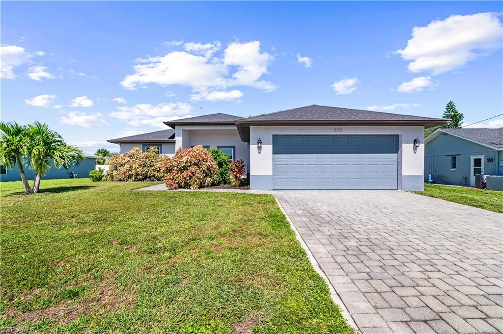 Bright and inviting 3 bedroom, 2 bath home in the Northeast Cape. Better than New... built in 2023 with 1,440 sq ft of living space, this move-in-ready residence features western exposure, city utilities and a split floor plan for privacy.  Highlights include impact windows, vaulted ceilings, shaker-style cabinets, a huge island with granite countertops, stainless steel appliances and wood-grain ceramic tile plank flooring throughout.  The private master suite offers granite counter tops, tiled shower surround and two closets.  Upgraded lighting, ceiling fans, covered porch, paver driveway, epoxy coated floors in the two car attached garage and irrigation compete this designer-upgraded gem.
