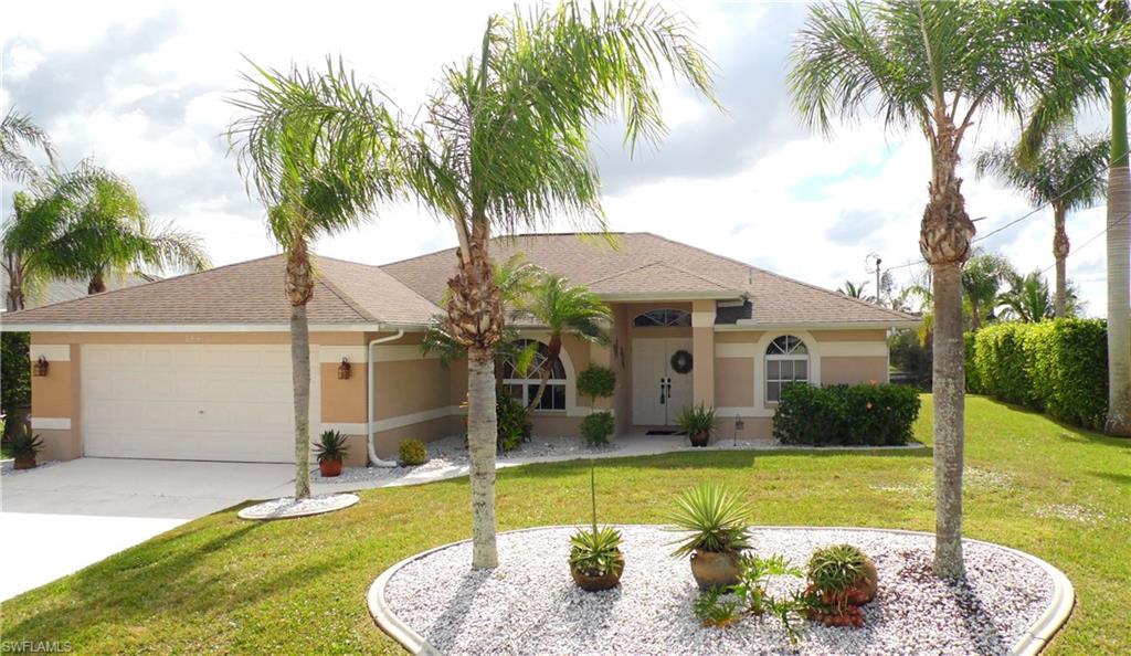 Paradise is the only word to describe this gorgeous 3 bed / 2 bath / 2 car garage pool home. This beautiful lakefront home will knock your socks off. Located in a quiet neighborhood, near shopping and dining. The curb appeal is wonderful w/ the beautiful entry way, decorative curbing around the trees, and the tropical landscaping. The spacious master has sliders overlooking the large covered lanai, the beautiful pool, and the gorgeous lake. POOL & AC IS ONLY 5 YEARS OLD! The master bath features a bath tub & a separate shower. The home features split bedroom plan for privacy, large kitchen, sports pool, pool safety fence, automatic water fill feature for the pool, very large lanai, irrigation system and a huge backyard overlooking a gorgeous lake, and much more. That was a very successful vacation rental and comes with all the furniture! Not in a flood zone. A MUST SEE!!!