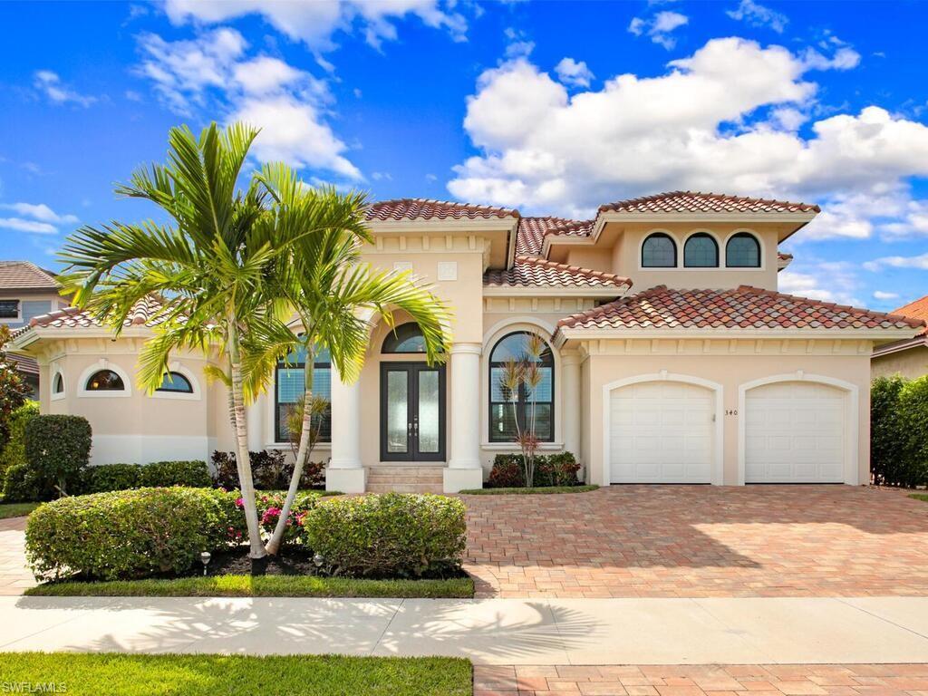 What a view from this recently built home! This two story home is situated on an oversized lot with fantastic wide water views from the second largest water indirect bay on the island. Enjoy sunsets from the large infinity edge pool or infinity spa. Custom wood cabinetry throughout, oversized outdoor living area, insect misting system, second story balcony, surround sound, camera system, large pantry, travertine floors, high ceilings, and high end furnishings are just some of the features of this lovely home.