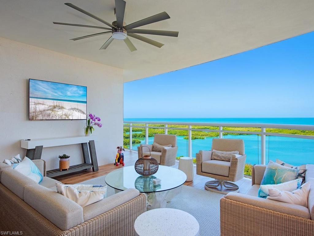 Experience stunning panoramic views of The Gulf! From this 16th-floor residence in Tower 300 at Kalea Bay, enjoy uninterrupted sunsets all year long. Boasting over 3,800 square feet, this 4-bedroom, 4.5-bath home features a private elevator that opens directly into your foyer, hardwood floors throughout, wood-paneled walls and beamed ceilings. The spacious, open design blends indoor and outdoor living beautifully. The large lanai, finished with upgraded coral walls and floor-to-ceiling glass doors, blurs the line between inside and out, perfectly framing the extraordinary Gulf scenery. The gourmet kitchen is appointed with Wolf and Sub-Zero appliances, a natural gas cooktop, beverage cooler, generous island, adjacent butler’s pantry, and modern cabinetry—ideal for entertaining family and friends. Wide living and dining spaces connect elegantly, highlighted by a quartz accent wall with fireplace and breathtaking views of the Gulf as your daily panorama. In the primary suite, a full wall of windows provides sweeping Gulf vistas, complemented by a luxurious bath with dual vanities, a soaking tub, an oversized walk-in shower, and a thoughtfully designed dressing room closet. Each guest suite offers its own bathroom and spectacular views overlooking the Club at Kalea Bay and the nearby Kinsale golf course. Residents of Tower 300 have access to five-star amenities including a rooftop pool with sweeping views, open-air social and fitness spaces, six grills, and 24-hour security. A complementary beach shuttle runs hourly from the lobby to the beach. Memberships are also available to Morea Bay. As members of The Club at Kalea Bay, owners enjoy exclusive resort benefits such as multiple pools, tennis courts, pickleball, two restaurants, a state-of-the-art fitness center, spa, and guest cottages. Discover the ultimate Naples lifestyle, defined by luxury and beauty!