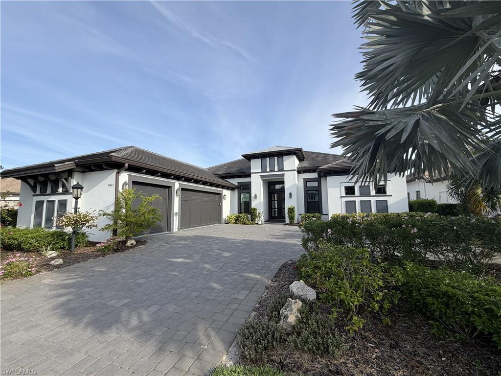 Rarely available, this exceptional waterfront residence offers an oversized homesite with ample room to add a private boat dock, providing direct access to Lake Como for boating, fishing, kayaking, and embracing the ultimate Southwest Florida waterfront lifestyle from your own backyard.  Perfectly positioned on a private cul-de-sac, the home delivers exceptional privacy and tranquility while showcasing refined luxury throughout. Offering 3 bedrooms plus a den and an oversized bonus room, this thoughtfully designed Beacon model blends elegance, comfort, and functionality with premium finishes at every turn.  Inside, an open and airy floor plan is enhanced by soaring tray ceilings and desirable southern exposure that fills the home with natural light. The gourmet chef’s kitchen serves as a true centerpiece, featuring quartz countertops, custom cabinetry, top-of-the-line GE appliances, a gas cooktop, double wall ovens, and dual wine coolers.  The luxurious owner’s suite is a private retreat, complete with spacious walk-in closets and a spa-inspired bath featuring dual vanities, a separate walk-in shower, and soaking tub.  Outdoor living is elevated with an expansive 2,600+ square-foot lanai highlighted by a spectacular saltwater pool with infinity-edge spa, surrounded by elegant marble decking set on poured concrete—ideal for entertaining or relaxing in style.  Built for comfort and peace of mind, the home includes impact-resistant doors and windows along with a whole-house Generac generator.  Located within the prestigious Esplanade Lake Club, residents enjoy world-class amenities including a state-of-the-art fitness center, resort-style pool and spa, tennis and pickleball courts, waterfront activities, white-sand beach, and a vibrant social scene. Gather with friends and relax at the Bahama Bar. Ideally located just minutes from RSW International Airport, shopping and premier dining options at Gulf Coast Town Center, this exceptional property delivers the perfect balance of luxury, recreation, and true waterfront living. Schedule your private showing today.