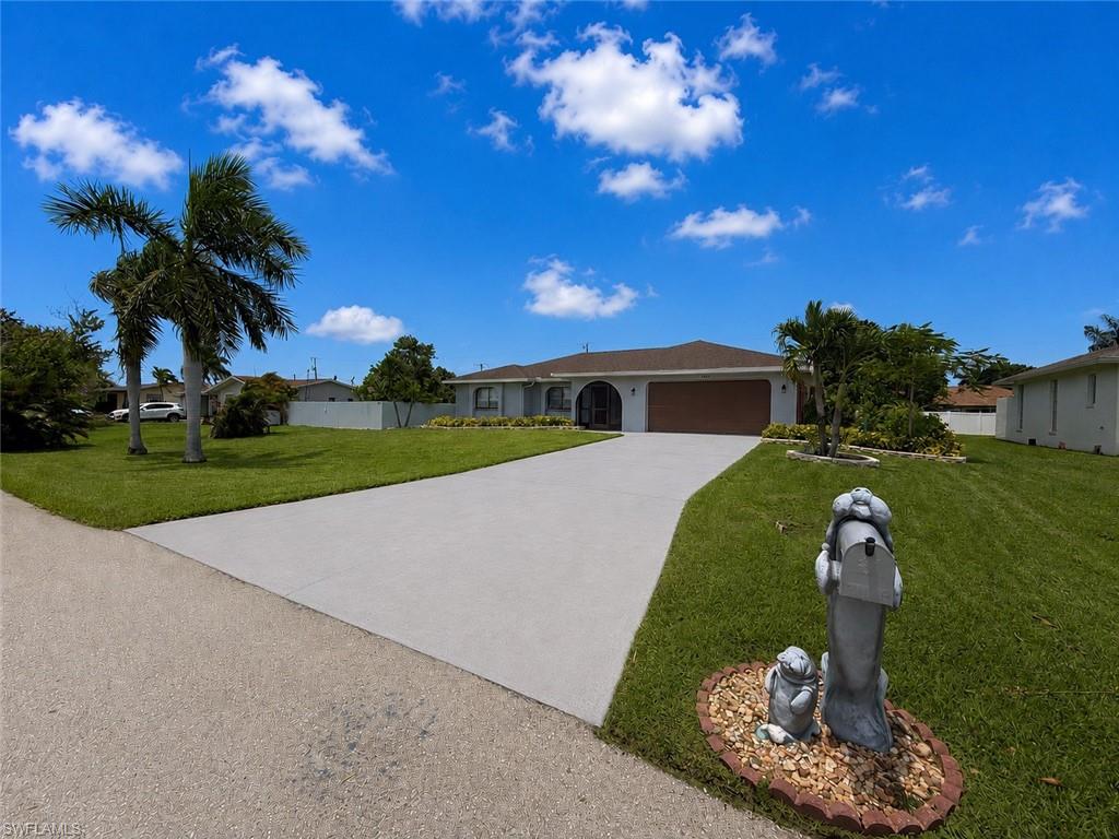 LOCATION, LOCATION, LOCATION! Welcome to this versatile centrally located 3-bedroom, 3-bath pool home offering over 2,000 square feet of living space in one of Cape Coral's most convenient locations. Just minutes from Veterans Parkway and the Midpoint Bridge, you'll enjoy quick access to Fort Myers while being surrounded by everyday conveniences including Publix, Aldi, Starbucks, Walmart, HomeGoods, Ulta, LA Fitness, a movie theater, bowling, restaurants, shopping and so much more.

Designed with flexibility in mind, this home features a unique private suite that separates two bedrooms and a spacious full bathroom with dual vanities from the main living area, complete with its own private entrance. Whether you're accommodating extended family, welcoming long-term guests, creating a private home office, or simply looking for additional privacy, this versatile space offers endless possibilities. Prefer a more traditional layout? The seller is willing to reopen the connecting wall at the seller's expense, seamlessly incorporating the suite back into the main living area prior to closing.

Step outside and discover your own tropical backyard retreat. The meticulously manicured landscape is complemented by mature palms creating a natural privacy wall, vibrant flowers, fresh herbs, and producing mango trees that yield approximately 200 mangoes each season. Relax by the pool, enjoy your favorite movie on the lanai's projection screen, or unwind under the custom outdoor lighting that creates the perfect Florida evening atmosphere.

Recent updates provide peace of mind, including a BRAND NEW pool cage/lanai enclosure, 2023 roof, 2023 A/C, 2025 pool pump, fresh interior and exterior paint, and a new impact-resistant window in the primary bedroom.

Whether you're searching for a full-time residence, seasonal retreat, or home with flexible living arrangements, this exceptional property offers the perfect combination of location, functionality, and Florida lifestyle. Schedule your private showing today and experience everything this Cape Coral gem has to offer. **Remember** the new property tax reduction requirements call for homeowners to be a resident by December 31st 2026!