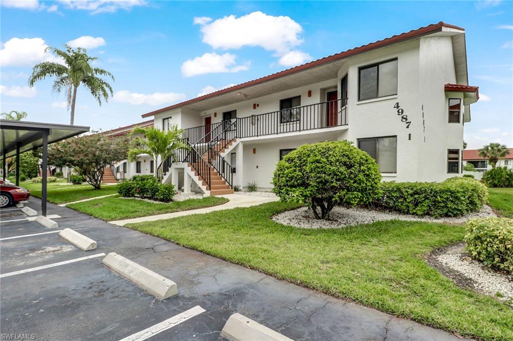 Welcome to paradise, in this beautifully remodeled 2 bedroom and 2 full baths condo. The location of this condo is great, within walking distance to Publix, and other shops, restaurants and more, and a short 10 min car ride to the beautiful white sandy Naples beach. This remodeled unit has new paint, new high end floors, granite counter tops  and many more extras, plus brand new stainless steel appliances, this unit is certain to amaze. Your car has an assigned spot in the shade under the well maintained car port. Pool is a skip and hop away. This could be your affordable dream place in paradise.