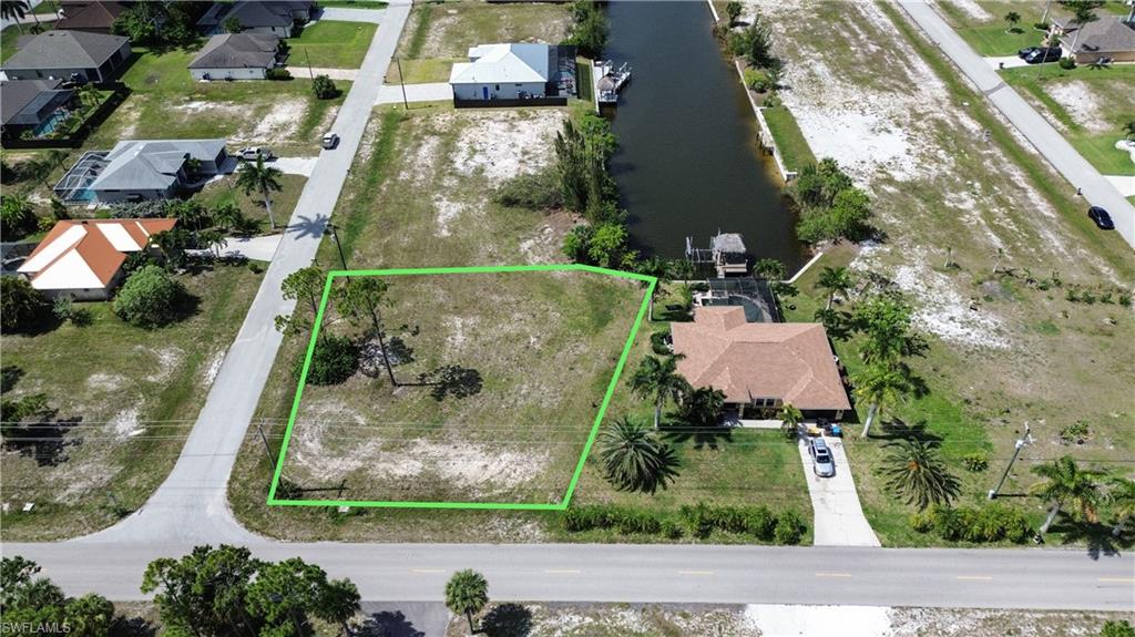 Exceptional Gulf-access corner lot located in the growing Northwest Cape Coral area. This cleared waterfront homesite is ready for your future dream home and already features a seawall, saving both time and development costs.

Situated on a canal with access to the Gulf of America, this property offers an ideal opportunity for boaters, fishing enthusiasts, builders, and investors seeking Southwest Florida waterfront living. The corner lot location provides added flexibility for home design, enhanced curb appeal, and additional privacy.

Enjoy the peaceful setting of Northwest Cape Coral while remaining conveniently located near shopping, dining, parks, golf courses, and the area's expanding commercial developments. Whether you are looking to build a seasonal retreat, primary residence, or investment property, this lot offers the space, location, and waterfront lifestyle that have made Cape Coral one of Florida's most desirable boating communities.

Don't miss this opportunity to secure a cleared Gulf-access homesite with a seawall already in place in one of Cape Coral's fastest-growing waterfront neighborhoods.