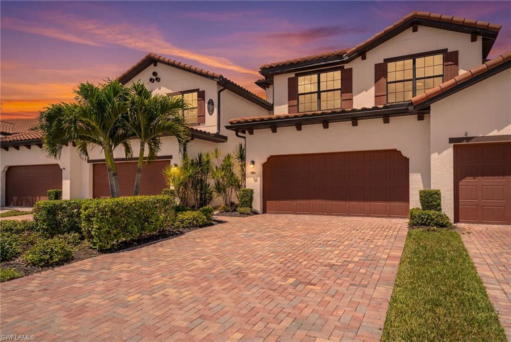 Move right in and start enjoying the Southwest Florida lifestyle in this beautifully appointed, fully furnished turnkey second-floor coach home offering over 2,250 square feet of living space, an expansive screened lanai, and western sunset views in the highly desirable Arborwood Preserve community. Designed for both everyday living and entertaining, this elevated residence features an open-concept floor plan with tile flooring throughout the main living areas and luxury vinyl plank flooring in the bedrooms. The thoughtfully upgraded kitchen is the centerpiece of the home, showcasing quartz countertops, an oversized island, marble backsplash, upgraded Kraus fixtures, GE appliances, LG dishwasher, custom lighting, and abundant cabinetry. A split-bedroom layout provides privacy for guests, while the spacious primary suite features dual walk-in closets, double vanities, and an oversized marble walk-in shower. Additional thoughtful upgrades include a newer Samsung washer and dryer, an elevated laundry room with a custom wood shelf, smart home technology with Alexa-compatible lighting and garage controls, reverse osmosis, whole-home water filtration, and custom accent walls. The oversized attached garage provides ample space for two vehicles plus a golf cart and includes an additional full-size refrigerator and chest freezer. Built with hurricane-impact windows and sliding glass doors and located outside of a flood zone, this home offers added comfort and peace of mind. Arborwood Preserve's impressive Town Center features a resort-style pool, fitness center, aerobics and yoga studio, tennis, pickleball and bocce courts, theater, coffee lounge, art studio, card room, and a full calendar of social activities. HOA fees include water, high-speed internet, and Wi-Fi for truly low-maintenance living. Ideally located just minutes from RSW International Airport, JetBlue Park, shopping, dining, and Southwest Florida's beautiful Gulf beaches, this exceptional turnkey home is equally suited as a full-time residence, seasonal retreat, or investment opportunity.