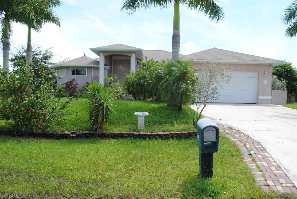 Very Large 3-2-2 With Southern Exposure, High Ceilings, Well Maintained & Clean. Over 2200 Square Feet Under Air, With A Huge Great Room & Large Formal Dinning Room. The Kitchen Has Dark Wood Cabinets, Solid Corian Counter Tops With An Island & Stainless Steel Appliances. There Is Tile Throughout The Main Areas, And Carpet In The Bedrooms. The Eight Foot Doorways & High Ceilings Really Open Up This Home. There Is A Full Screened Lanai To Relax And Enjoy The Weather & There Is Room For A Pool. This Home Also Has Automatic Roll Down Shutters On All The Windows And Entry Ways To Help Protect Against Inclement Weather And For Added Security When Away From Home. Call Today For Your Private Showing!
