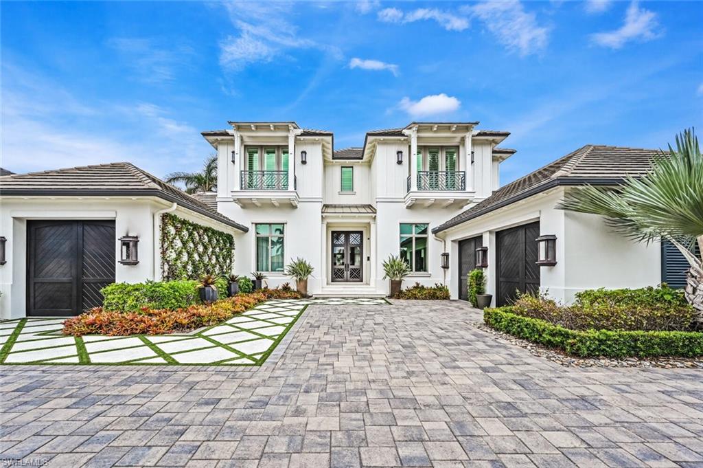 This Stofft Cooney design, Knauf-Koenig built, Fully Furnished by Clive Daniel home, features 4 oversized guest bedrooms/en suites, and master area that features his and her walk-in California Closets, electric blackout shades, and an additional Elan Home Automation screen, for full control of the home. As you walk through this well thought out floor plan, you will find an expansive family room with floor to ceiling windows that allows plenty of natural light, with this homes preferred southern exposure. The family room will lead into the oversized Chef's Kitchen with Sub-Zero Wolf Appliances and a full butler's pantry. On the second level you will find 3 of the 4 oversized guest en suites, along with a bonus room that can be used as an office or game room. Relax by your Resort Style salt water pool/spa while enjoying the Florida weather that also features a poolside cabana, covered outdoor living area with roll down shades, fireplace, mounted TV, and built-in summer kitchen. This Moorings Gem has it all, and all within minutes of Historic Downtown Naples, The Sandy Gulf Beaches, and all that Naples has to offer!