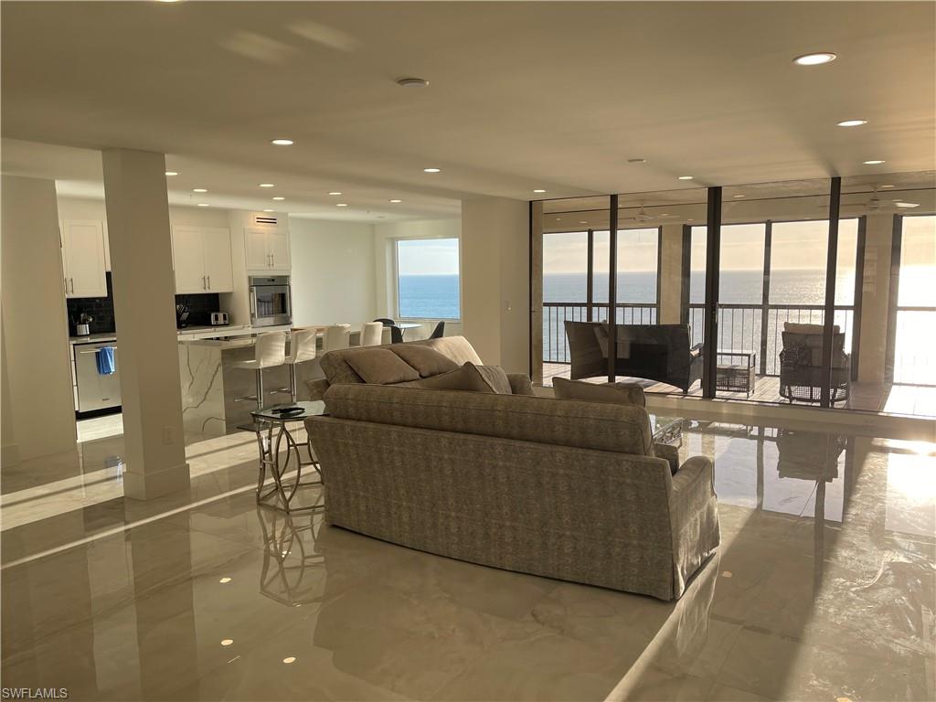 NEW PHOTO'S COMING - Direct Beachfront High-End 16th Floor Unit for GREAT VIEWS. This COMPLETELY REMODELED UNIT has a re-imagined, NEW FLOOR PLAN, OPENING UP LIVING ROOM/KITCHEN to GULF VIEWS. Upgrades include: raised ceiling, bathrooms redesigned, Cabinets, Designer Floors, Bathrooms & more! With over 2,600 square feet of living space, this stunning condo lives like a single-family home & boasts never-ending trade winds & panoramic Gulf views from nearly every room. The Carlysle recently underwent a MULTI-MILLION DOLLAR RENOVATION to its lobby, front entrance, elevator lobby's, driveway and landscaping.  Delight in having the powder-soft beach in your own backyard & front row seats to majestic sunsets & sunrises from the comfort of your 2 screened lanais. The chef's kitchen is outfitted with top-notch appliances. Entertaining is easy with the open floor plan, 3 separate dining areas (inside & out) & massive kitchen island. Additional features include 2 underground parking spaces. Bay Colony & Pelican Bay amenities include 3 beachfront Resturants, 3 Tennis Centers, almost 3 miles of private beach, fitness center & biking paths.