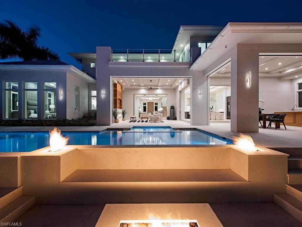 Just completed! Thoughtfully drawn by Falcon Design Inc., meticulously constructed by BBA Development Inc., and tastefully appointed by NP Interior Design this coastal contemporary new construction home has an open, great room plan that lends itself to casual, yet refined, living. Fantastic first floor master suite with massive closet, study/optional 5th bedroom, and 3 upstairs en-suite bedrooms with media/bonus room, breakfast bar, additional laundry facilities and a full bath. Great covered and uncovered outdoor living spaces offer relaxed living ideally positioned with southern exposure for year round sunshine on the pool area. Full size lot offers up to 80 feet of dockage and just minutes to Naples Bay with no-bridge, deep water access to the Gulf of Mexico. 3-Car garage can accommodate lifts for the auto enthusiast. This ideal location offers a very short walk to the beach and to the shops/dining of historic Third Street South, while providing a quiet, non-thru traffic street.