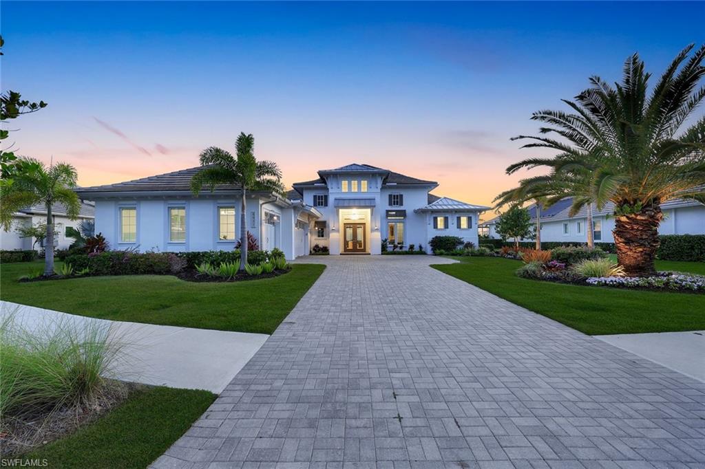 Luxury living at it's best in The Isles of Collier Preserve. This exceptional furnished pool and spa residence, built by renowned STOCK Development, showcases the highly sought-after Cocoplum floor plan and offers more than $500,000 in post-builder upgrades.
Perfectly positioned on a private preserve lot with coveted southwest exposure, the home delivers breathtaking sunset views and an unmatched sense of tranquility. The preserve setting is truly extraordinary, offering a rare, nature-filled backdrop unlike anything else in Naples.
Designed for both elegant entertaining and everyday luxury living, the open-concept layout is filled with natural light, soaring ceilings, and expansive pocketing glass sliders that seamlessly blend indoor and outdoor spaces. The spacious great room features custom built-ins, a fireplace, coffered ceilings, and a sophisticated dining area complete with a built-in bar and dual wine coolers. Designer chandeliers and premium finishes elevate every space throughout the home.
A beautifully appointed office/den includes custom cabinetry and built-ins, while the private owner’s suite offers direct lanai access, dual custom walk-in closets, a spa-inspired bath with soaking tub, walk-in shower, and dual vanities. Each guest suite includes its own en-suite bathroom, providing exceptional comfort and privacy for family and guests.
The gourmet chef’s kitchen is both functional and stunning, featuring an oversized island, breakfast bar, gas cooktop, two walk-in pantries, abundant cabinetry, and designer backsplash details.
Outdoor living is equally impressive, with expansive covered and open-air spaces designed for year-round enjoyment. The resort-style lanai features a fully equipped outdoor kitchen with island seating, a saltwater pool and spa with waterfalls, and panoramic preserve views that create a true private retreat.
Residents of The Isles of Collier Preserve enjoy world-class resort amenities including the Overlook Bar & Grill, resort and lap pools, fitness center, tennis, pickleball, bocce, dog park, paddleboarding, kayaking, and more than seven miles of scenic walking and biking trails along the Cypress Waterway. The community also adjoins Hamilton Harbor Marina on Naples Bay for larger boating access.
Ideally located just minutes from historic downtown Naples, hip Bayshore Drive and the area’s renowned beaches, this remarkable residence offers the ultimate blend of luxury, privacy, and resort-style living.