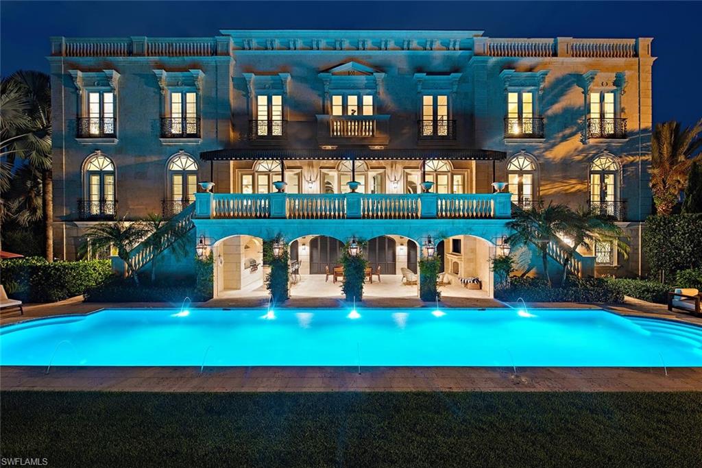 Welcome to an incredible and iconic custom built home situated on a rare oversized parcel in an enviable location right in the heart of Old Naples just steps from the Gulf of Mexico, world renowned 5th Avenue South, and Naples pristine white sand beaches.  Exceptionally constructed, meticulously maintained, and beautifully landscaped, this timeless and classical residence offers an unparalleled combination of highlights including 5 bedrooms + study, over 7,300 sq/ft of air conditioned space, a generous open layout, chef’s kitchen with 3 islands, 7 car garage, rooftop sunset deck, private elevator, natural gas supply, extensive storage areas, and a generous covered outdoor kitchen and living space complete with massive 70’ pool and large yard space. This is a unique and extraordinary opportunity to own a one-of-a-kind home.
