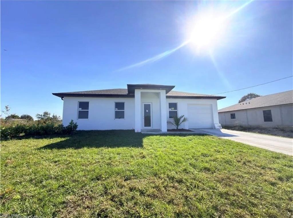 Brand-new construction in the rapidly growing community of Lehigh Acres! This beautifully crafted home offers 3 bedrooms, 3 full bathrooms, and 1,355 SqFt of thoughtfully designed living space on a generous ¼-acre lot. The open-concept floor plan features a bright and spacious living area, a modern kitchen with quality finishes, and a functional layout perfect for everyday living and entertaining. Built with impact-resistant windows and doors for added safety, energy efficiency, and peace of mind. Enjoy the freedom of NO HOA, giving you more flexibility with your property. The expansive backyard offers endless possibilities, including space for a pool, outdoor entertaining, or future customization. For security purposes, the kitchen appliances are not shown in the photos but will be installed prior to closing. Whether you’re looking for your primary residence or a great investment opportunity, this move-in-ready new construction is a must-see. Schedule your private showing today!