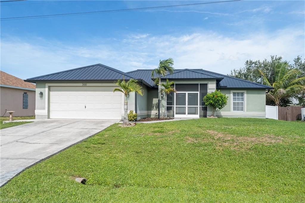 Solid value in NW Cape Coral — a 3-bedroom, 2-bath single-family home built with the upgrades that matter in Southwest Florida. The standout is the metal roof, offering durability and potential insurance advantages that most homes in this price range can't match. Inside, you'll find an upgraded main bathroom, plantation shutters throughout, and updated ceiling fans and lighting fixtures. An automatic sprinkler system keeps the yard maintained, and the garage includes built-in shelving for storage. Clean, move-in ready, and easy to show. Located in the growing NW Cape near shopping, schools, and the Burnt Store corridor, with quick access to Pine Island Road. Property is being sold as-is; refrigerator, washer, and dryer are not included. Sale is subject to third-party approval by seller's lender. Priced to sell — an opportunity for buyers who want a well-kept home with big-ticket items already handled. THIRD PARTY PROCESSOR REQUIRED. SEE ATTACHED DISCLOSURES THAT MUST BE SIGNED AND PRESENTED WITH ALL OFFERS.