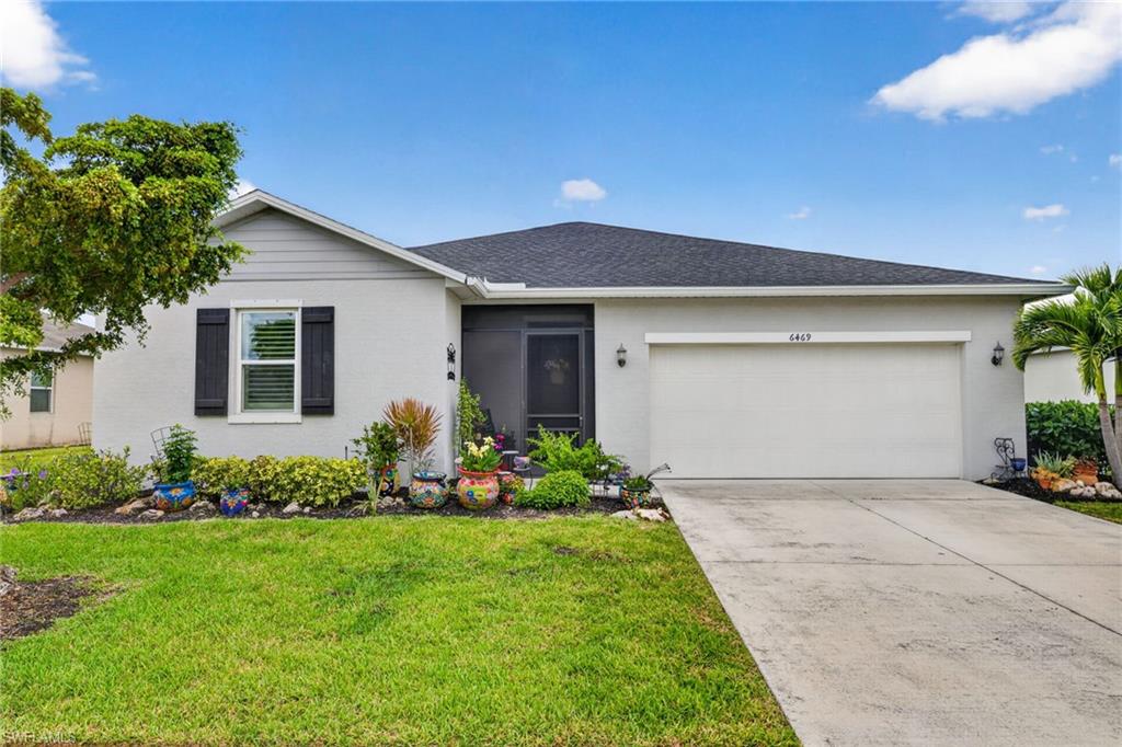 Welcome to The Coves of Estero Bay, a charming gated community in the highly desirable Island Park area. Built in 2019 by KB Home, this meticulously maintained 3-bedroom, 2-bathroom residence offers 1,585 sq. ft. of living space with a private split floor plan. True pride of ownership shines throughout this deeply cared-for home, offering ultimate peace of mind with absolutely no history of flooding from past hurricanes.

The property features a brand-new HVAC system with UV light mold prevention, a brand-new stove, and a brand-new washer & dryer. Basking in abundant natural light, the interior boasts custom plantation shutters, upgraded semi-gloss paint, and $11,000 in new luxury wood-style flooring through the main areas, tile in wet areas, and new Berber carpet in the primary suite. The functional kitchen features granite countertops and premium cabinetry.

Relax in the primary suite with its garden tub and expansive walk-in closet, or step outside to the screened lanai equipped with an automatic screen system. The fully fenced backyard is a tranquil oasis showcasing two pink plumeria trees, a majestic Royal Poinciana, and a shady live oak. Complete with an epoxy-finished garage floor, community pool access, and gated security, this move-in-ready gem is ideally located near premier shopping, dining, SWFL beaches, and RSW Airport. Your perfect Florida lifestyle awaits!