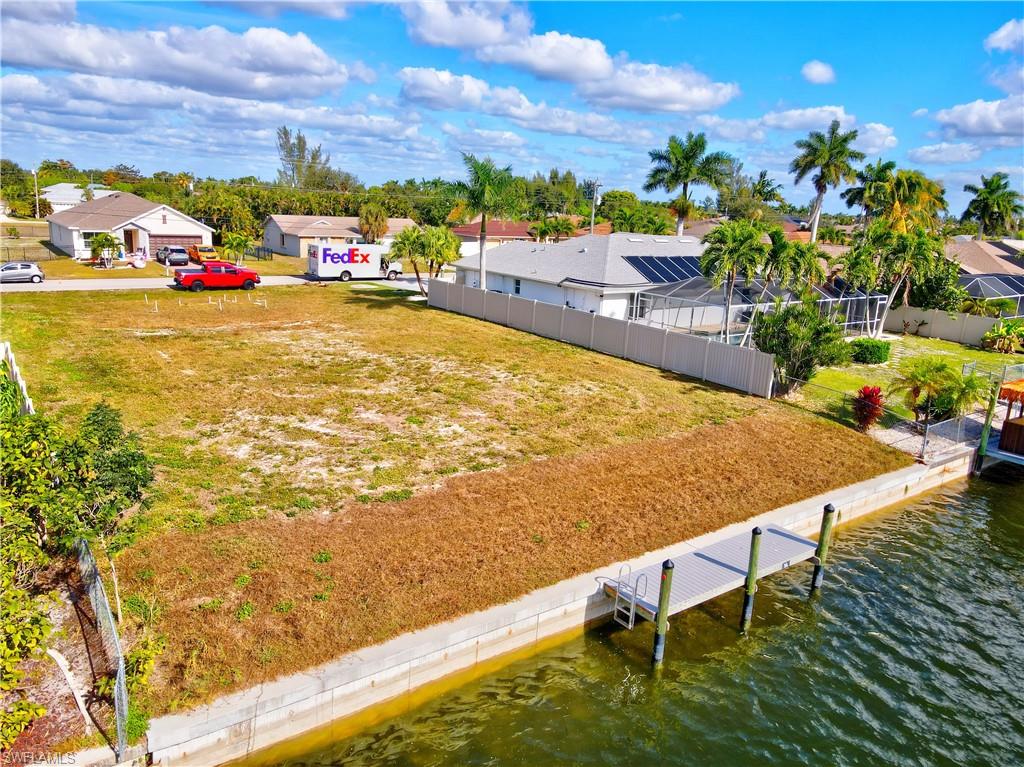Build your dream home on this .26-acre waterfront homesite located on a quiet freshwater canal in Cape Coral, Florida. This property features a brand-new dock and a brand-new seawall, offering immediate waterfront enjoyment and long-term peace of mind. With southern exposure, enjoy abundant natural light and stunning sunset views year-round. All city assessments are paid, adding significant value. Conveniently positioned with easy access to Fort Myers, just minutes from Veterans Parkway and Santa Barbara Boulevard, this location makes commuting and daily errands effortless. Golf courses, shopping, dining, parks, airports, and Southwest Florida beaches are all nearby. Surrounded by newer homes in a growing area, this lot is perfect for a primary residence, vacation home, or investment opportunity. A rare chance to own a move-in-ready waterfront lot
with major improvements already in place.
