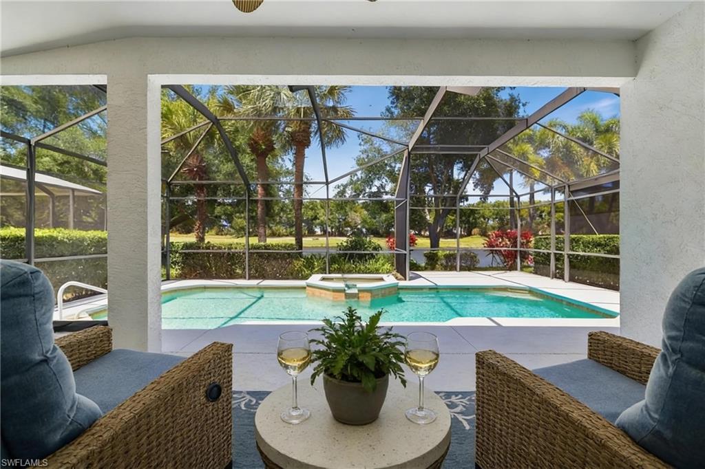 One or more photo(s) has been virtually staged, AI generated or rendered.  Experience a refined waterfront retreat within the prestigious Miromar Lakes Beach & Golf Club, consistently recognized among the nation’s most celebrated communities. This beautifully updated single-family residence offers two bedrooms plus a den and two bathrooms, thoughtfully blending modern enhancements with timeless design.

Recent improvements elevate the home’s appeal, including new hardwood flooring in the bedrooms, refreshed tile in the primary bath shower, updated lighting and fans throughout, and a freshly painted interior. A brand-new roof adds peace of mind, while the exterior is being enhanced with a sophisticated grey and white palette, creating a clean, modern look.

Outdoor living is where this home truly shines. The oversized lanai provides an inviting setting for both relaxation and entertaining, complete with freshly painted floors, a heated pool and spa, and a built-in summer kitchen. Enjoy sweeping views of the lake and the 16th hole, offering a picturesque backdrop that captures the beauty of the surrounding landscape. Pool service is included for added ease, allowing you to fully enjoy the lifestyle this home offers.

Life at Miromar Lakes is centered around an unparalleled collection of amenities designed for both leisure and activity. Residents enjoy a stunning resort-style pool, private white-sand beach along a 700-acre freshwater lake, and a vibrant Beach Club with waterfront dining and social events. Multiple on-site dining options, a full-service spa, and a state-of-the-art fitness center create a well-rounded, elevated living experience.

For those who enjoy staying active, the community features tennis, pickleball, and basketball courts, along with a marina offering boat storage and access to a variety of water activities including skiing and kayaking. Additional amenities include a fishing pier, clubhouse, theater, library, concierge services, and scenic walking and biking paths that wind through the community’s beautifully maintained grounds.

This residence offers the perfect balance of comfort, style, and resort-inspired living in one of Southwest Florida’s most sought-after destinations.