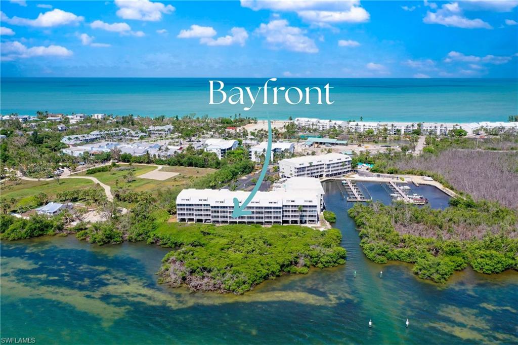 At 5132 Bayside Villas, each day is written in light, water, and breeze. Dawn begins on the lanai, where Pine Island Sound awakens with color—sunrise glows across the horizon, pelicans skim the waves, and fishing boats slip toward open water. The bay becomes your backdrop, alive with sails, seabirds, and the shifting palette of the sky. The villa itself balances coastal charm with modern ease. A 1BD/2BA first-floor retreat, it offers granite counters, stainless appliances, crisp cabinetry, wide-plank tile flooring, and crown molding. The living spaces flow naturally to the lanai, where the outdoors remains the centerpiece. The primary suite offers a calm retreat, while a second bath mirrors the same fresh finishes. Yet what makes this villa extraordinary is not just the design—it’s the rhythm of Captiva life outside its doors.  Within minutes, you can sink your feet into the Gulf sands, celebrated for their shells and sunlit shallows. Island pathways invite golf cart rides and bike cruises into Captiva Village, where the hum of music, dining, and laughter sets a different tempo. Afternoons bring choices: a swim in the bayside pool, a paddle through calm waters where dolphins are frequent companions, or a wander through palm-lined trails.  As the day winds down, the stage shifts once more. Perhaps you’ll gather with neighbors for cocktails while the boats return across the channel or cross the island to witness sunset blaze into the Gulf. And when evening deepens, stars scatter above the mangroves, promising another sunrise to come.  With amenities like under-building parking, private storage, and a bayside pool and spa, 5132 Bayside Villas offers not just a home but an island way of life—measured in sunrises, sails, and timeless Captiva moments.