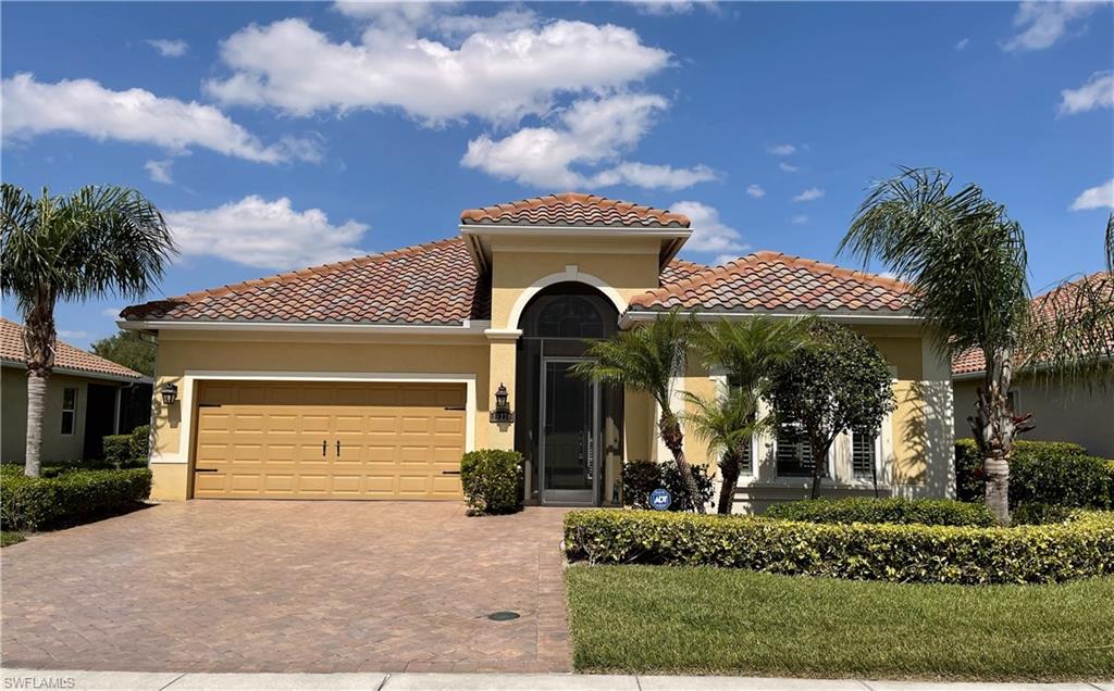 This beautiful lakefront BRIDGETOWN home is waiting for you.  If you are looking for a truly wonderful house in a great neighborhood, come see this impeccably maintained 2BR+Den/2BA home.  The tasteful colors and soaring ceilings will WOW you!  The open floor plan with large windows allows the bright Florida sunshine in.  The kitchen boasts granite countertops, a walk-in pantry and stainless steel appliances including a new refrigerator.  If architectural details are important to you, take note of the high arches, 8ft doors and 18inch tile on the diagonal.  A full wall of sliders in the Living Room leads you to the extended lanai where you can enjoy your morning coffee or the evening sunsets.  The Main Bedroom has a slider to the lanai, 2 walk-in closets and a Bath with a dual vanity and separate tub and shower.  The Den has French Doors and hardwood floors.  Storage abounds in this house with many closets, cabinets in the Laundry Room and Garage.  The AC was replaced in 2020. Bridgetown amenities include Bocce, Pickleball, Tennis, Fitness Center, Resort style pool, lap pool, fire pit and picnic area.  Don't wait to schedule your showing.