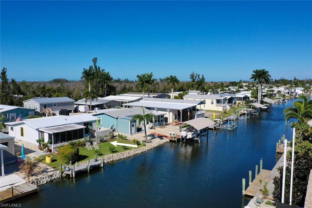 Welcome to Pine Island Cove! This 2 bed 2 bath canal home is located in the highly sought after 55+ Boating and Fishing Community in the heart of Saint James City. Direct access the Pine Island Sound from your canal affords this home the ideal southwest Florida gulf coast lifestyle. This active community has a clubhouse, pickleball courts, bocce courts, heated pool and spa, gulf access boat ramp, boat & RV storage, picnic and grill area, fish cleaning station and washout facilities all for just $150 monthly dues. Enjoy your sparkling canal views in the enclosed sunroom or open patio overlooking thoughtfully landscaped lawn and dock. Interior of home is lovingly maintained, fully furnished and ready to make your own. A perfect seasonal or year round slice of paradise.