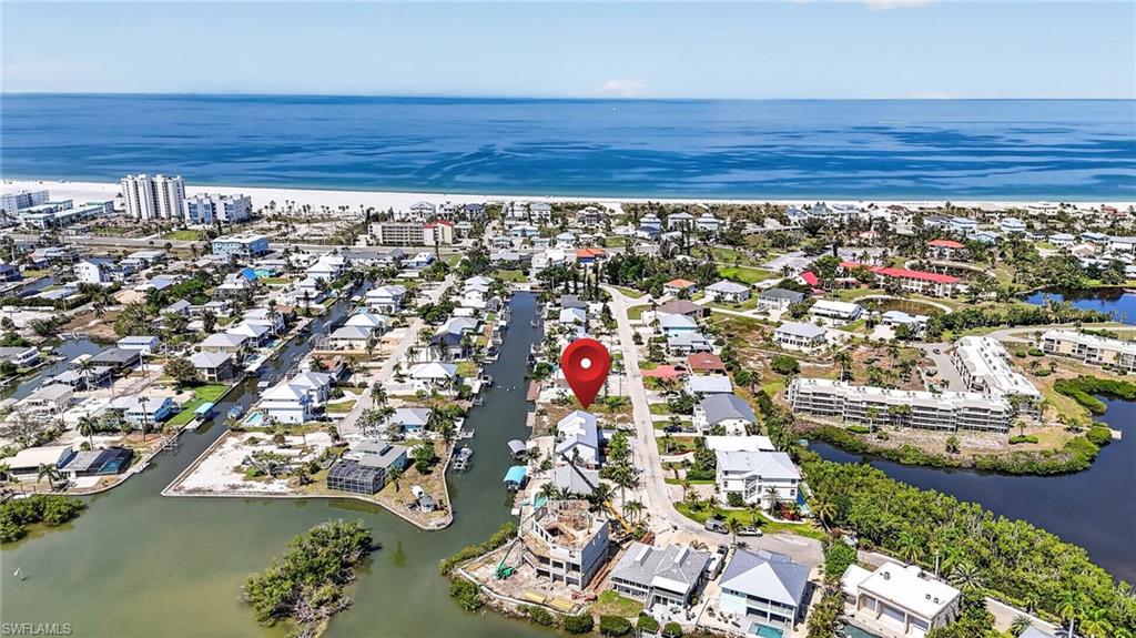 Gulf access waterfront lot offering 49 feet on a wide canal ready for a new single to 4-plex pool home with boat dock. Combine this lot with the adjoining lot at 21571 Widgeon for twice the space and water frontage. The lot sits close to Estero Bay so boaters can cruise directly into the Bay and on to the Gulf.  Walking or biking to Flamingo beach is one block away. The Widgeon neighborhood sits on a cul de sac street and is alive with new homes and on-going construction.  Imagine great views of the bay and gulf, a new home and dock and this place will deliver. The benefits of building new equate to a higher return on investment and personal enjoyment. Close to all the attractions with no HOA.