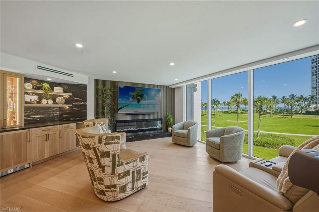 Completely reimagined in 2025, this Monaco Beach Club residence blends modern living with effortless beachfront elegance in the highly desirable Park Shore neighborhood. Offering three private en-suite bedrooms, a screened balcony, expansive floor-to-ceiling windows and wall-to-wall sliders capturing beautiful Gulf views. Thoughtfully redesigned with both style and functionality in mind, this home features luxury wood flooring throughout, an oversized laundry room, abundant storage space and much more. The beautifully appointed kitchen includes quartz countertops and backsplash, Bosch stainless steel appliances, soft-close cabinetry and under-cabinet lighting. Ideal for entertaining, the living area is highlighted by a custom slat-wood accent wall, a dry bar, and an electric fireplace. The spacious primary suite offers a peaceful escape with a beautifully finished en-suite bathroom featuring an oversized walk-in shower and walk-in closet. Monaco Beach Club offers spectacular beachside, resort-style amenities, including a pool and spa, social room, fitness center, 24/7 front-desk personnel, professional in-house management, bike storage and access to the private 1.3-mile Park Shore promenade. Boating enthusiasts can purchase or lease a slip at the Venetian Bay Yacht Club, while waterfront boutiques and exceptional dining at Venetian Village are just steps away.
