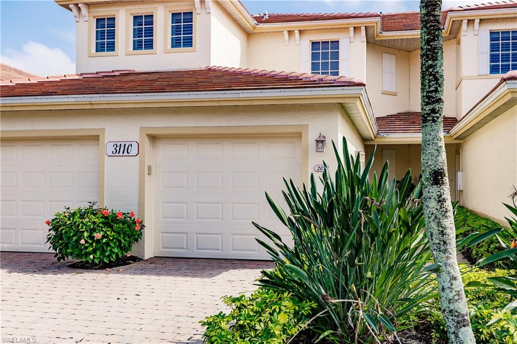 Spectacular coach home with a Lake and golf course view and Eastern exposure with multiple upgrades. This is a MUST see. A Brand new roof installed in 2020. New A/C installed in 2020. Recently painted inside, updated light fixtures and fans. Plantation shutters in all the windows. It features neutral colors throughout, newer stainless steel appliances in Kitchen with nice backsplash, new carpet on stairs and bedrooms and tile throughout the remainder of the home. Rooms are spacious and very bright. Lanai is expansive and has Electric storm smart shutters. It is a perfect place to enjoy the wonderful views and relax in the evenings with a beverage or to enjoy in the morning with your coffee and paper. Idlewild has their own neighborhood pool within walking distance. The Verandah also offers amenities which include two 18 hole golf courses, tennis program with pro, fitness center with director and classes, spa services, community pool, very active activities calendar, formal and casual dining room, bar, kayaking, bocce, 9 miles of biking/walking paths, dog park and playground. Come secure your place in Paradise NOW!