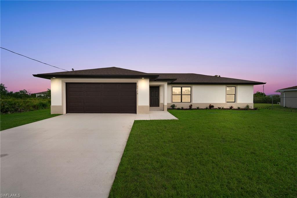 Welcome home! This beautifully designed home offers the perfect blend of comfort and style, with an open-concept living and dining area that flows seamlessly to a screened lanai—ideal for entertaining family and friends or enjoying Florida's indoor-outdoor lifestyle. Inside, you'll find 9'4" ceilings, elegant tray ceilings in the living area and primary bedroom, recessed lighting, stainless steel appliances, tile flooring throughout, and a spacious primary suite featuring a walk-in closet. The garage includes a convenient laundry tub for added functionality. Thoughtfully upgraded by the builder, this home showcases impact-resistant windows, quartz countertops, an under-truss patio, and a full irrigation system. This home offers easy access to shopping, grocery stores, schools, dining, and everyday conveniences. Enjoy quick access to Daniels Parkway and I-75, providing convenient connections to beaches, downtown Fort Myers, and the surrounding Southwest Florida area. For added peace of mind, the home includes a 2-10 Home Buyers Warranty as well as a two-year septic system service agreement from the date of installation. Photos shown are from a previously completed 3-bedroom model with 8' ceilings. Numerous builder upgrades that may not be reflected in the photos shown. Finishes and features may vary slightly.