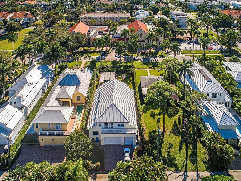 The incredible location of this charming Old Florida residence is a rarity in Old Naples today. Situated a mere 3 blocks from the Gulf and just 4 blocks from the fine shopping and dining of 5th Avenue South. The agenda will be beach filled days and upscale dining at night, all without the hassle of finding parking. The current home features a recent guest wing addition that is ensuite and features a separate living area and full kitchen. Along with a separate entrance, this provides premium convenience accommodating short or long term guests. Comfortable living until future construction plans are realized.