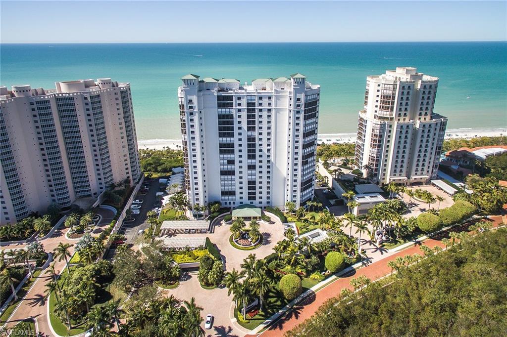 Why be near the beach when you can be on it, with exceptional views from above and a floor plan to match? Surround yourself with sunrise-to-sunset Gulf and bay views from three spacious balconies and gracious floor-to-ceiling bay windows of high-impact-resistant glass. This exemplary residence features 9-foot ceilings, three bedrooms, each with generous walk-in closets, three full baths, handsome Siematic kitchen cabinets with granite countertops, stylish marble, wood and carpeted flooring, two-car parking in secured under-building garage. Amenities include 24-hour manned front desk, two guest suites, fitness center, social rooms, resort-style pool and spa. Minutes to private Bay Colony beach and tennis clubs. Golf membership available separately.