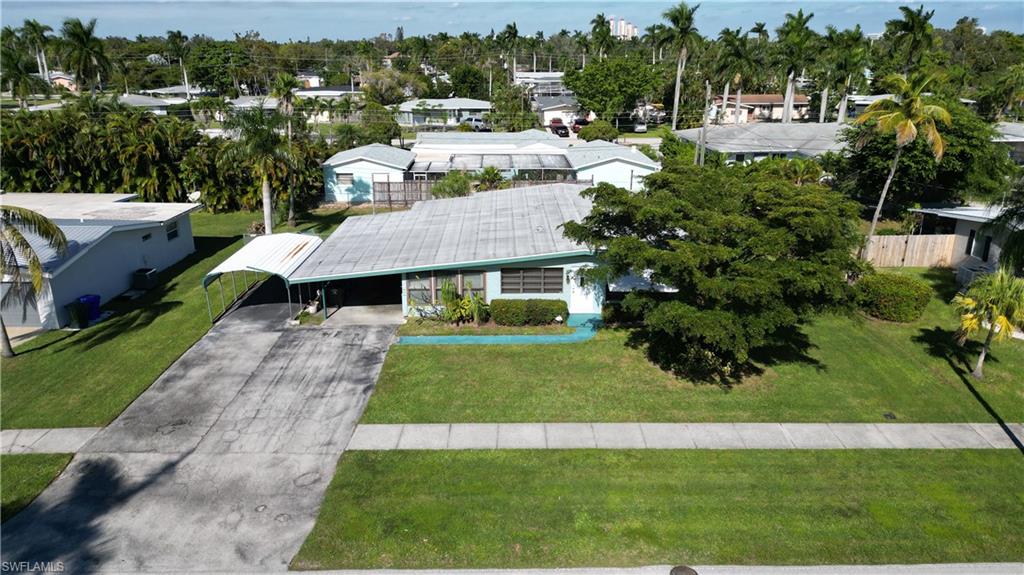 Charming 3BR/2BA home, perfectly located near Fort Myers Country Club off the historic McGregor Boulevard. Enjoy the best of both worlds with no HOA fees and no flood zone worries. This gem sits on a generous double lot, offering privacy with its fully fenced yard and ample space for a pool. The enclosed lanai is perfect for relaxing evenings. This home also features a family room, washer and dryer, 2 carport spaces, recently updated hot water heater, hurricane shutters and other storm protection. Recent upgrades include a new water heater and updated bathrooms. A short drive to downtown Fort Myers, resturants, and schools. This home offers convenience and serenity, ideal for those seeking a peaceful lifestyle at an affordable price with easy access to city amenities.